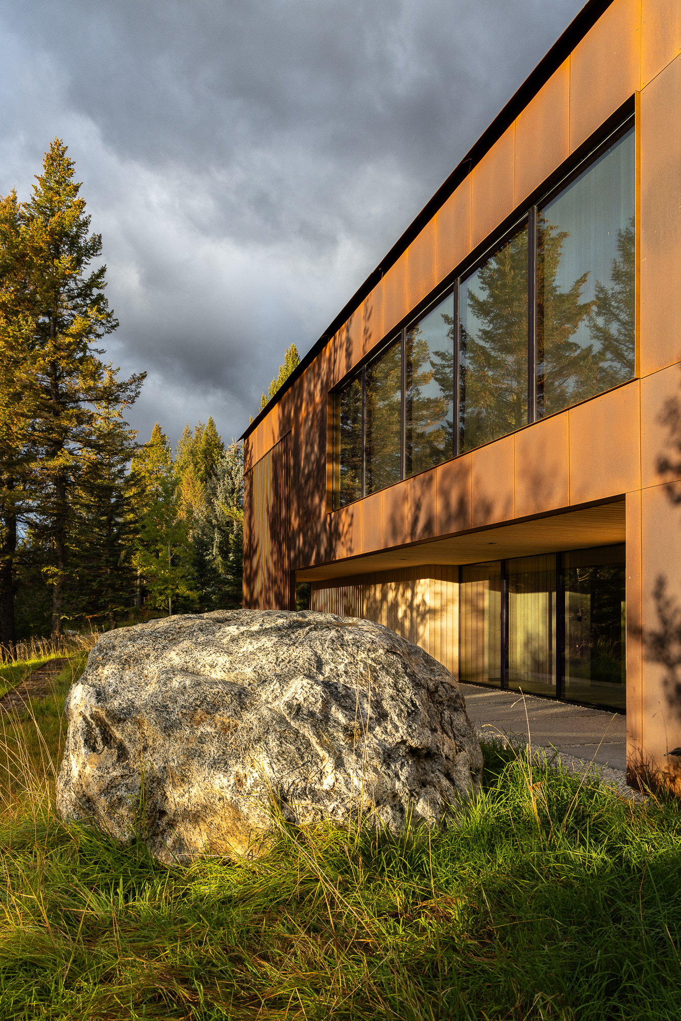 A modern home designed by clb architects in a fall setting in the forest. Photography by Aaron Kraft Krafty Photos