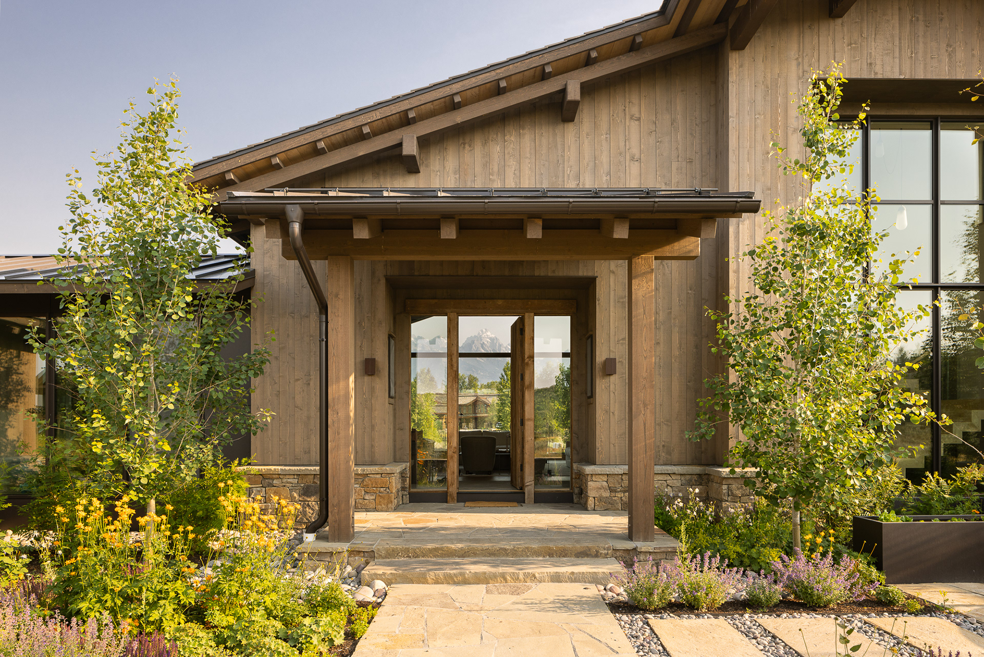 A modern mountain chalet in Jackson Hole, Wyoming designed by Berlin Architects and Cairn Landscape architects. Photography by Aaron Kraft Krafty Photos, Winter and summer architecture photography, landscape architecture photography, interior design photography