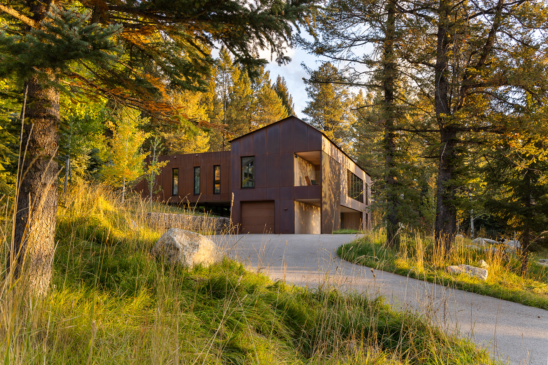 A modern home designed by clb architects in a fall setting in the forest. Photography by Aaron Kraft Krafty Photos