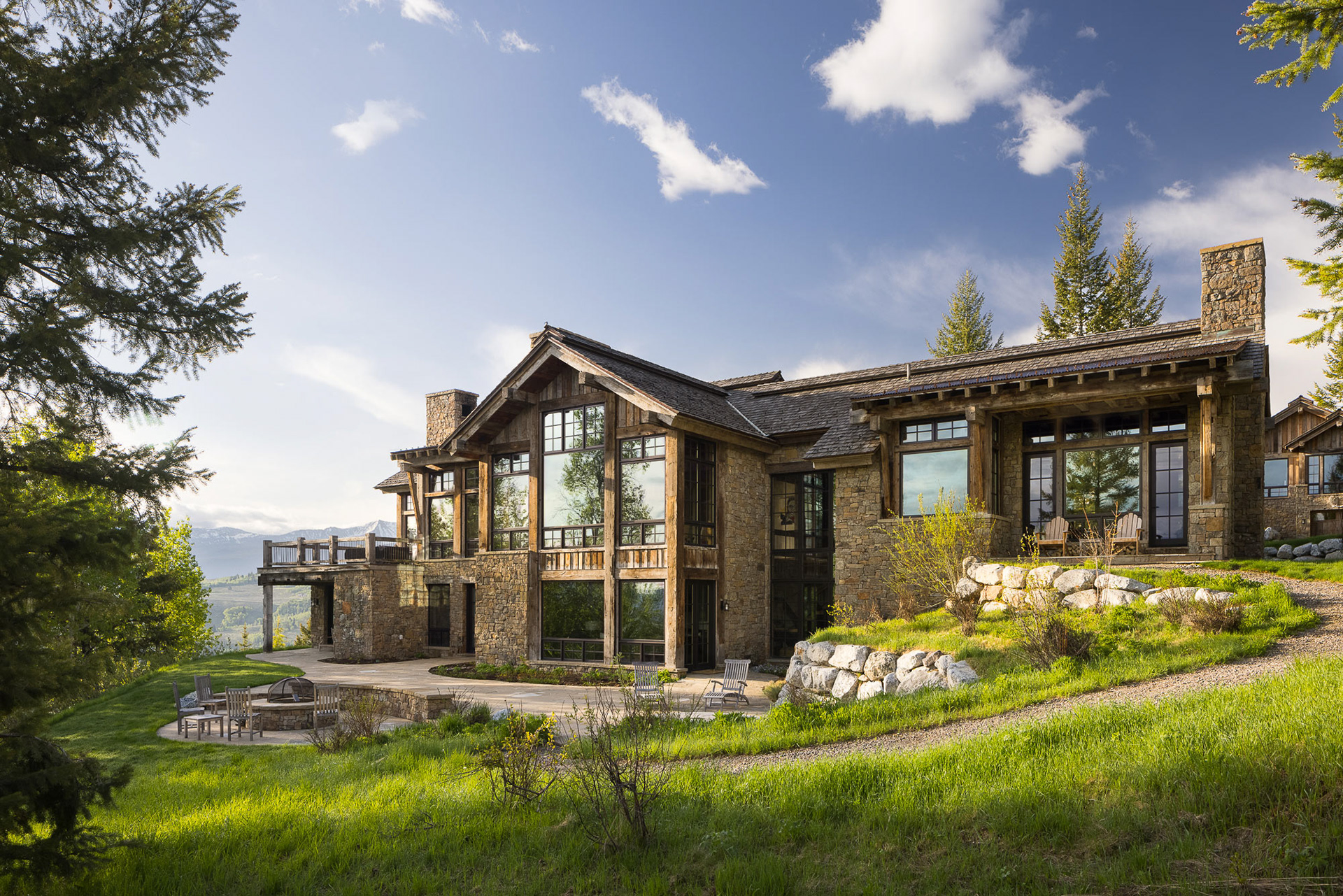 early morning aerial photograph of a Berlin Architects project photographed in early spring overlooking the Snake River and the Teton mountain range. Photograph by architectural photographer Aaron Kraft of Krafty Photos in Jackson hole wyoming