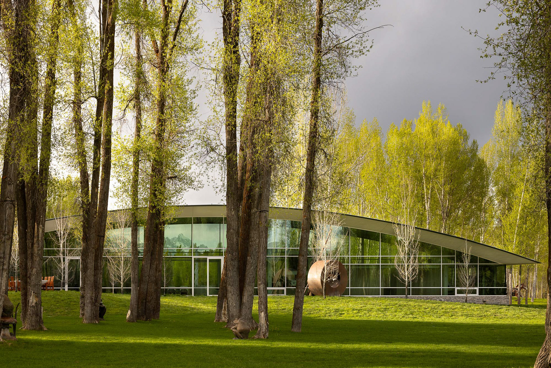 River House designed by architect Wallace Cunningham photographed at sunset in early spring. Photograph by architectural photographer aaron kraft krafty photos. architecture in Jackson Hole Wyoming.  Image 