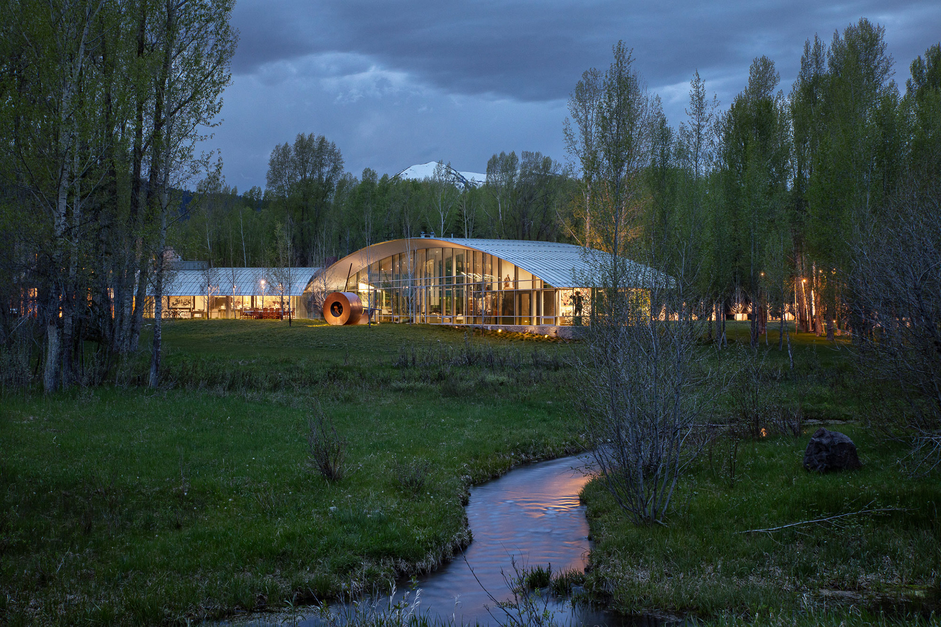 River House designed by architect Wallace Cunningham photographed at twilight in early spring. Photograph by architectural photographer aaron kraft krafty photos. architecture in Jackson Hole Wyoming.
