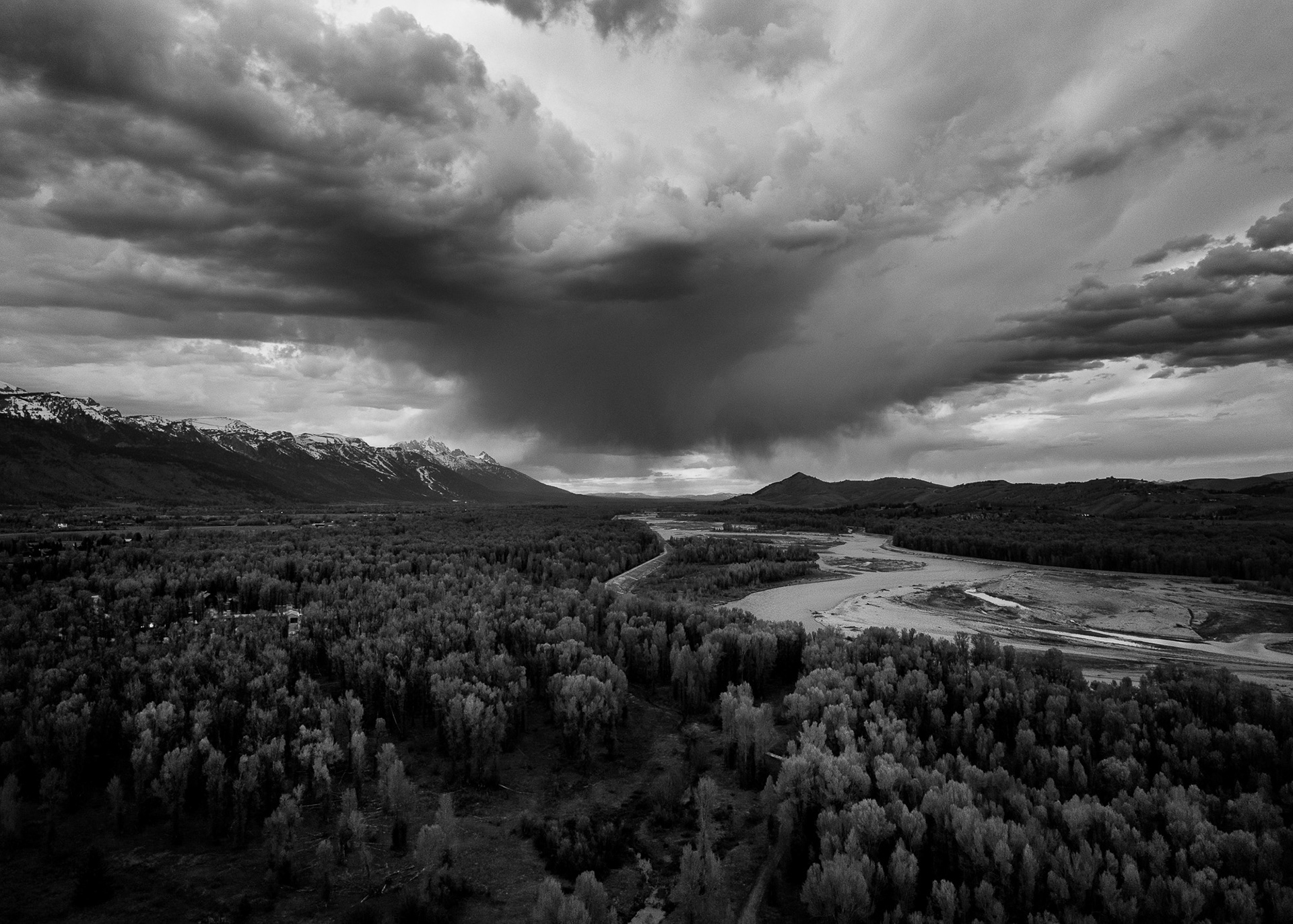 River House designed by architect Wallace Cunningham photographed at sunset in early spring. Photograph by architectural photographer aaron kraft krafty photos. architecture in Jackson Hole Wyoming. aerial drone image