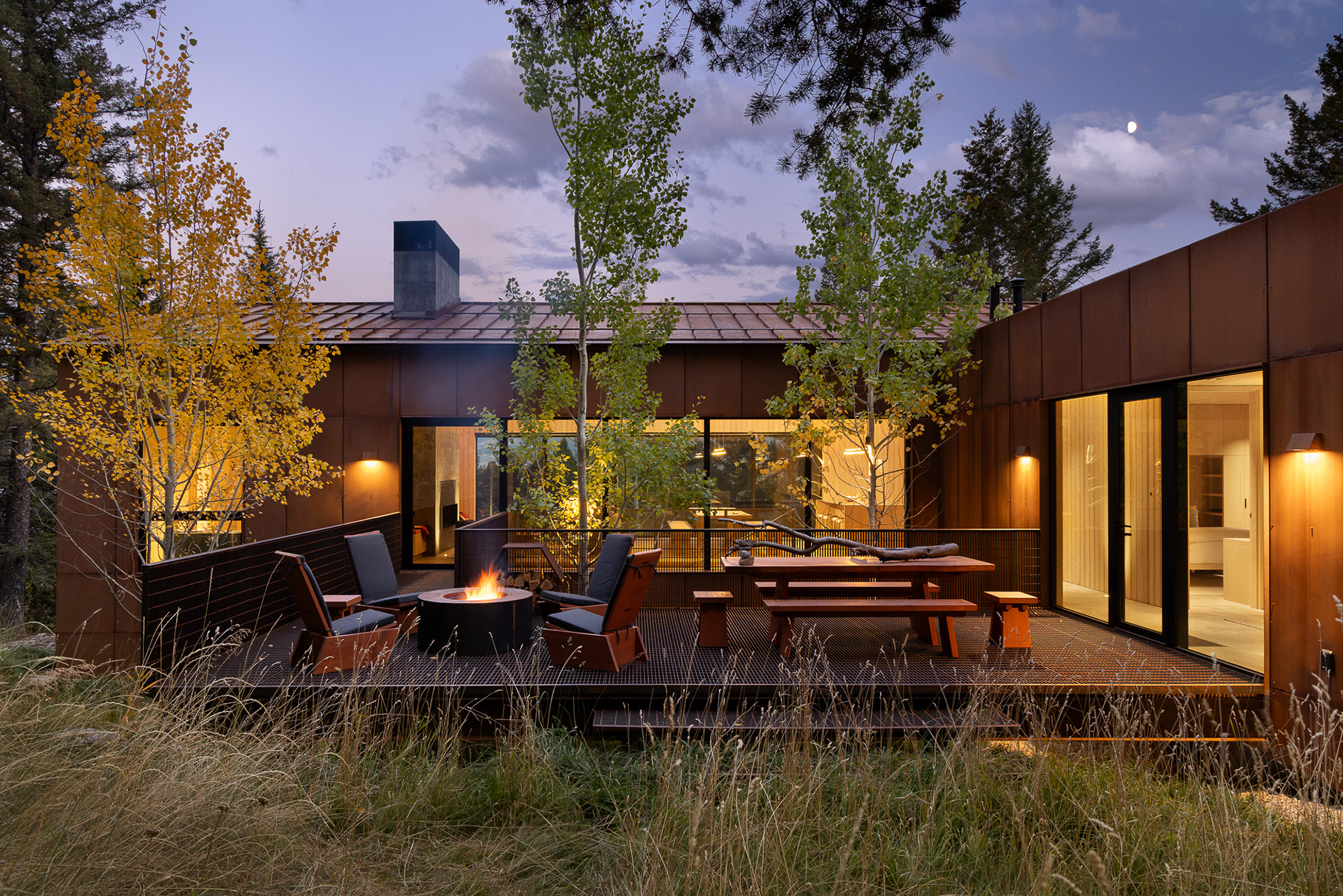 A modern home designed by clb architects in a fall setting in the forest. Photography by Aaron Kraft Krafty Photos