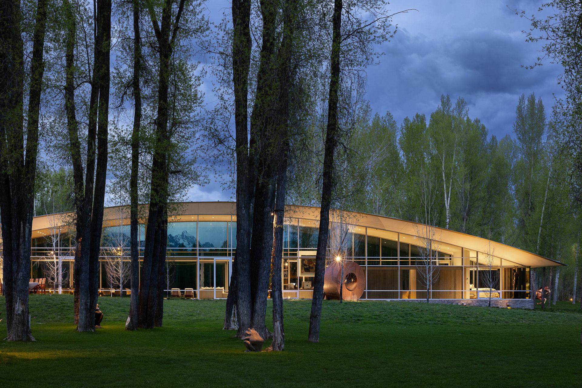 River House designed by architect Wallace Cunningham photographed at twilight in early spring. Photograph by architectural photographer aaron kraft krafty photos. architecture in Jackson Hole Wyoming.