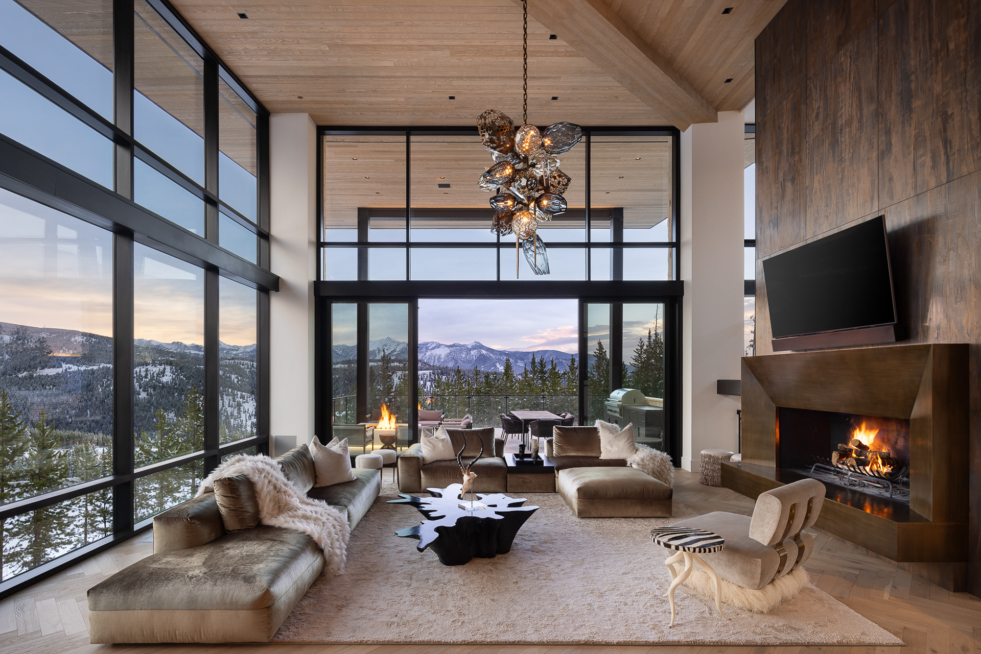 Big Sky Home at the Yellowstone Club in Big Sky, Montana.  Wintry scenes of a modern home designed by Reid Smith Architects with interior design by PFH Design. Twilight photography, Interior design photography, architecture photography, Photography by Aaron Kraft, Krafty Photos in Jackson Hole, Wyoming