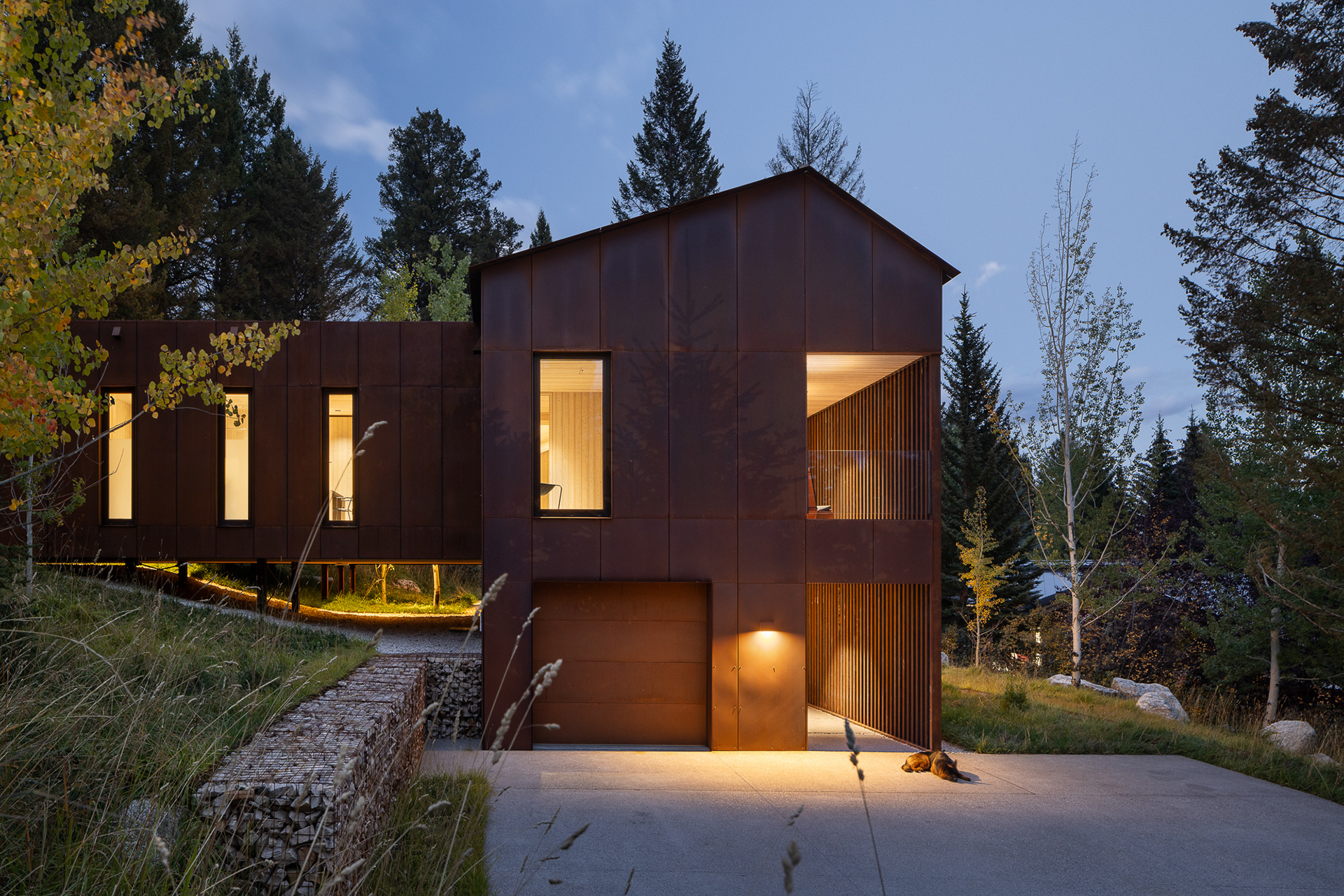 A modern home designed by clb architects in a fall setting in the forest. Photography by Aaron Kraft Krafty Photos