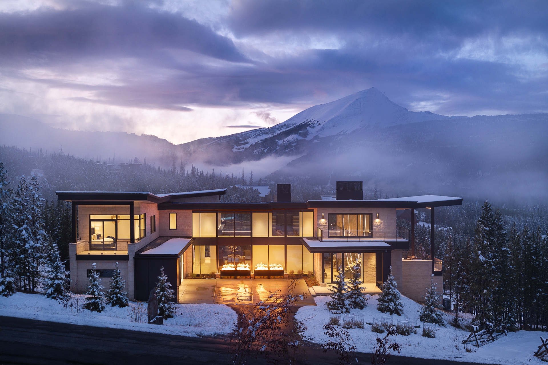 Big Sky Home at the Yellowstone Club in Big Sky, Montana.  Wintry scenes of a modern home designed by Reid Smith Architects with interior design by PFH Design. Twilight photography, Interior design photography, architecture photography, Photography by Aaron Kraft, Krafty Photos in Jackson Hole, Wyoming