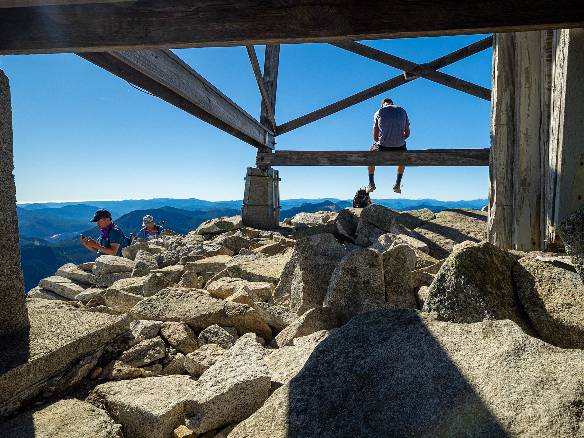 Summit rest stop at the Granite Mountain lookout, 1717m.  Alpine Lakes Wilderness, Washington, USA.