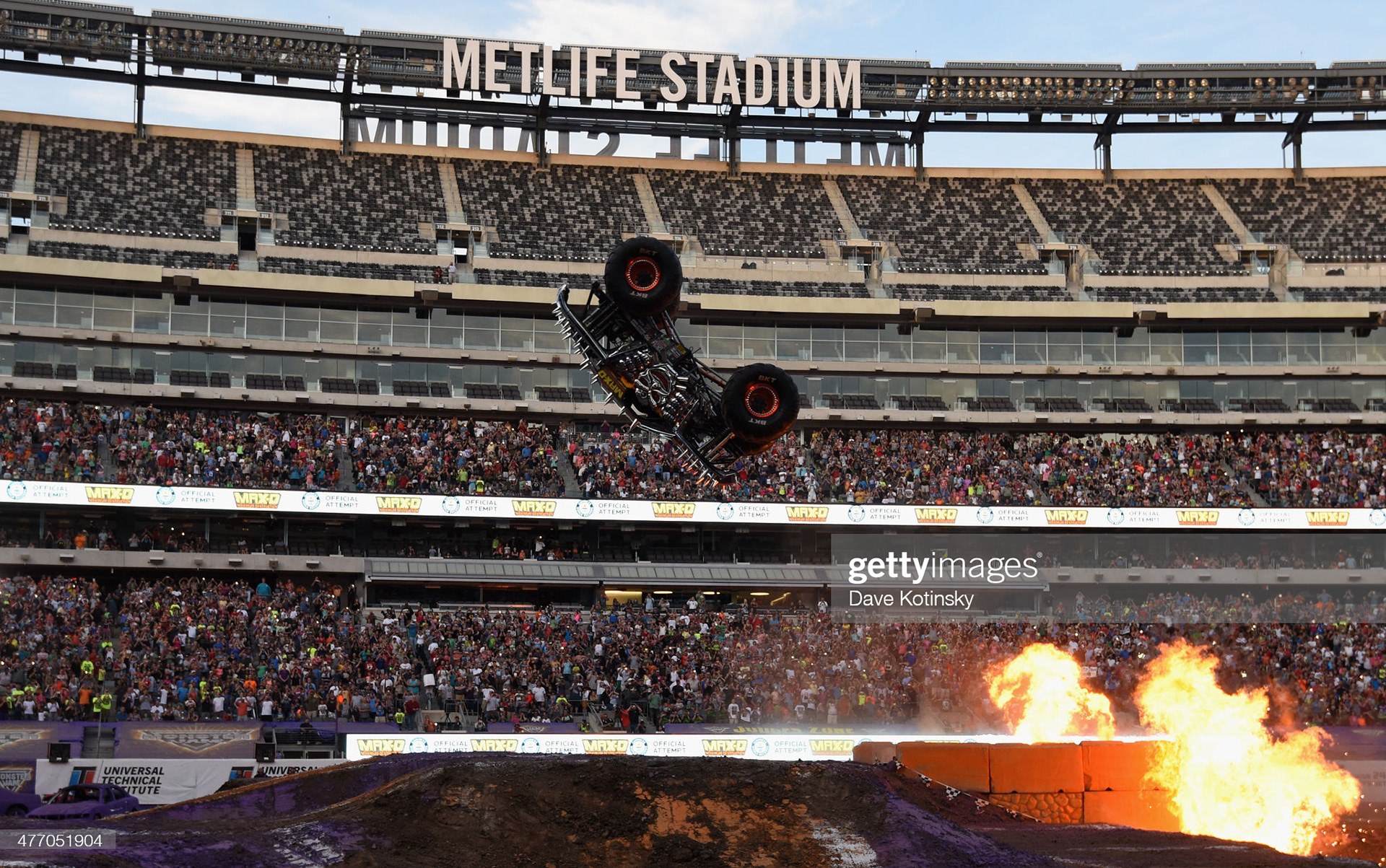 Tom Meents, 11-time Monster Jam World Finals® Champion, just missed establishing a new GUINNESS WORLD RECORDS title for landing the first-ever front flip of a 10,500 pound monster truck. Meents completed a full forward rotation, landing on Max-D's rear tires, however bounced into an over-rotation so that his front tires did not hit the ground, as required by the GUINNESS WORLD RECORDS guidelines. On this photo, World Champion Tom Meents attempts a never-before-done front flip of his Monster Truck at MetLife Stadium on June 13, 2015 in East Rutherford, New Jersey. (Photo by Dave Kotinsky/Getty Images for Metlife)