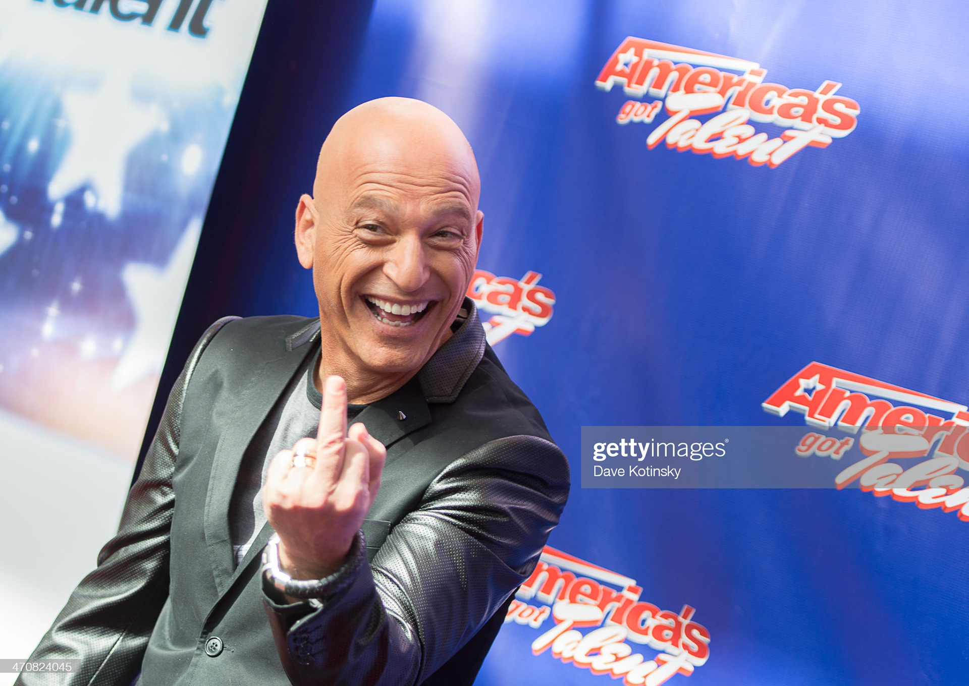 Howie Mandel arrives at the "America's Got Talent" Season 9 Photo Call at New Jersey Performing Arts Center on February 20, 2014 in Newark, New Jersey. (Photo by Dave Kotinsky/Getty Images)