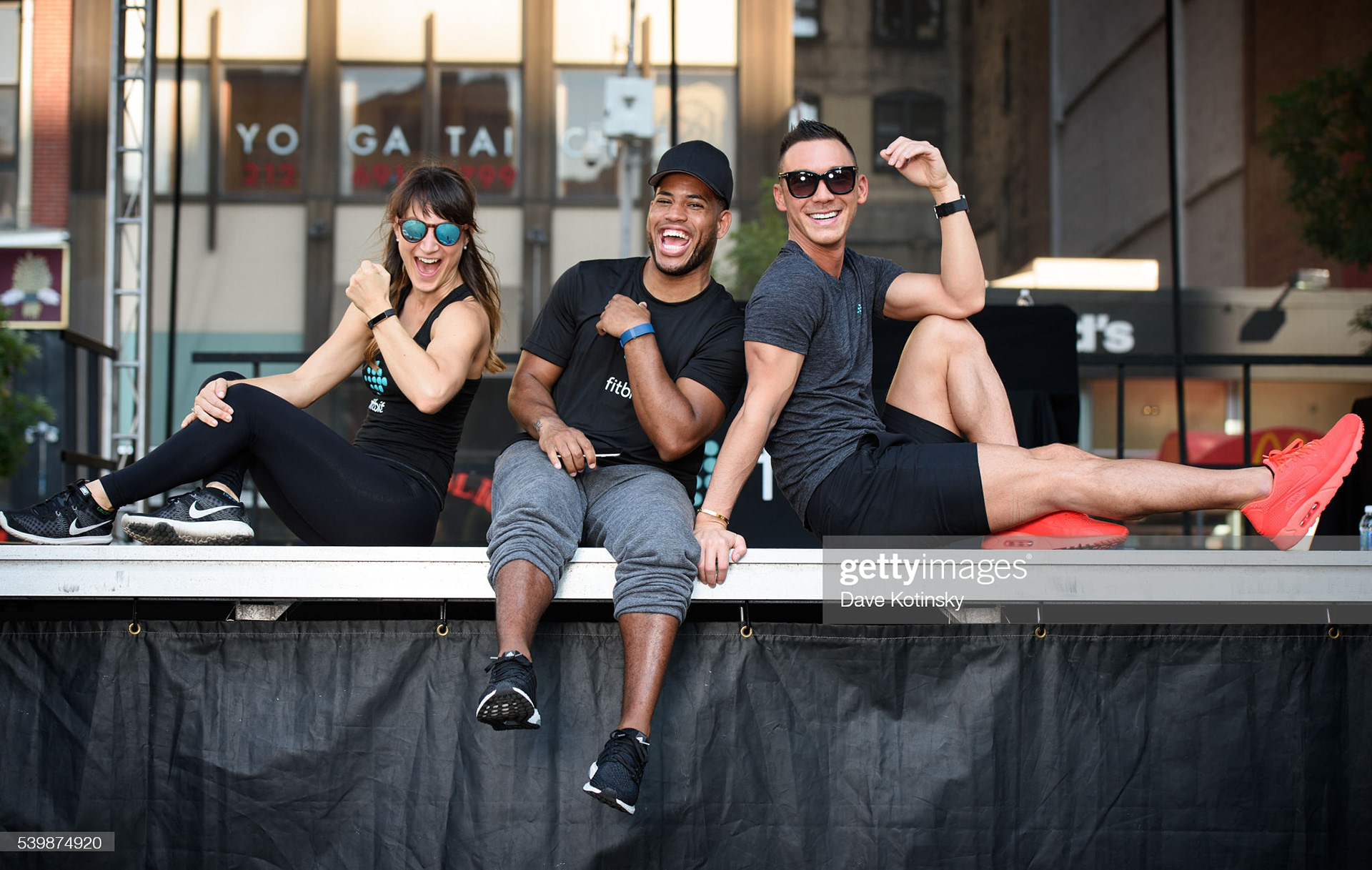  Fitbit Local Ambassadors Lauren Taus(L), Josh Martinez(C) and Jason Tran(R) leads the Launch Of Fitbit Local Free Community Workout on June 12, 2016 in New York City. (Photo by Dave Kotinsky/Getty Images for Fitbit)