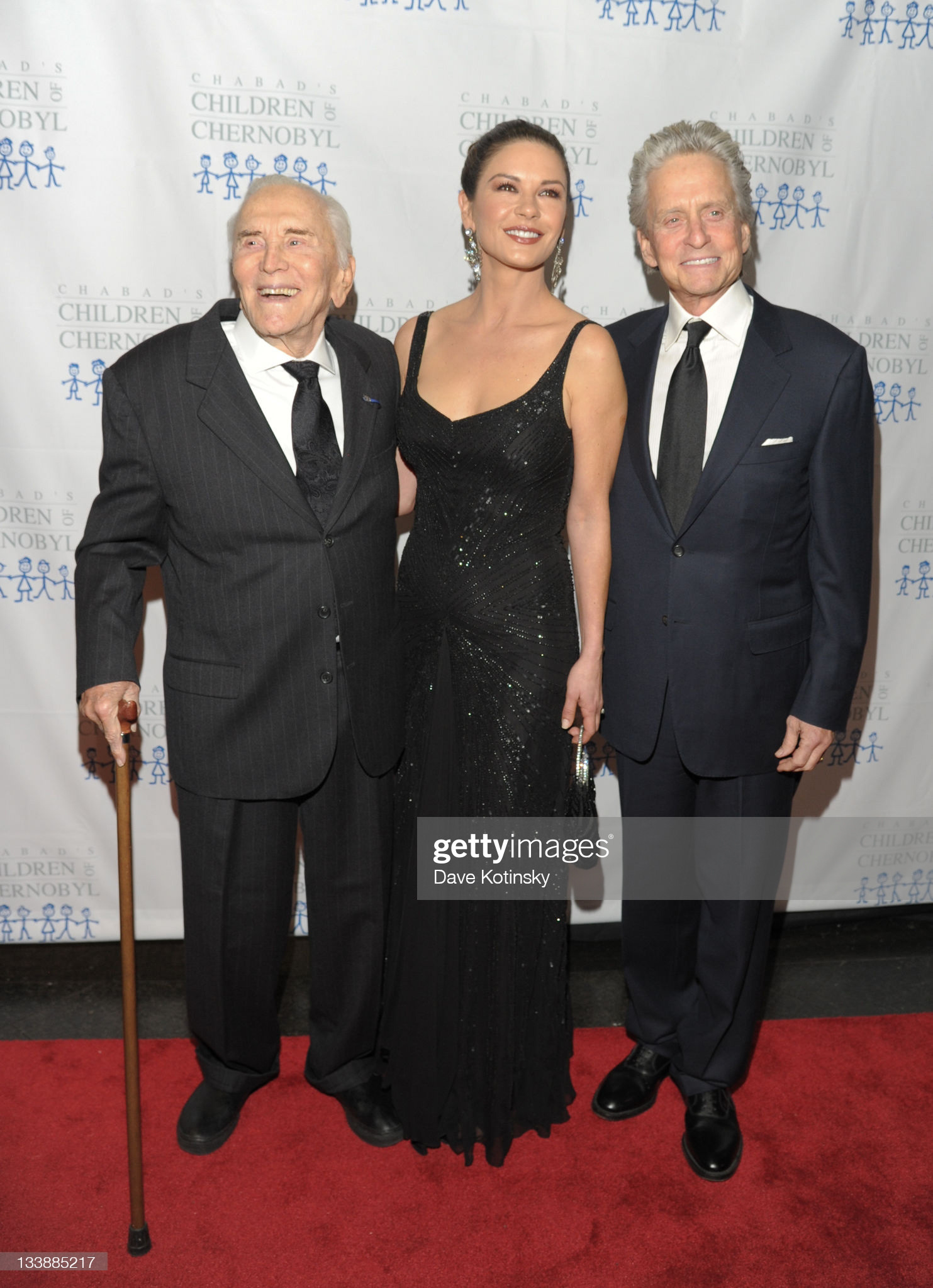 Kirk Douglas, Catherine Zeta-Jones and Michael Douglas attend the 2011 Children of Chernobyl's Children at Heart gala at the Chelsea Piers on November 21, 2011 in New York City. (Photo by Dave Kotinsky/Getty Images)