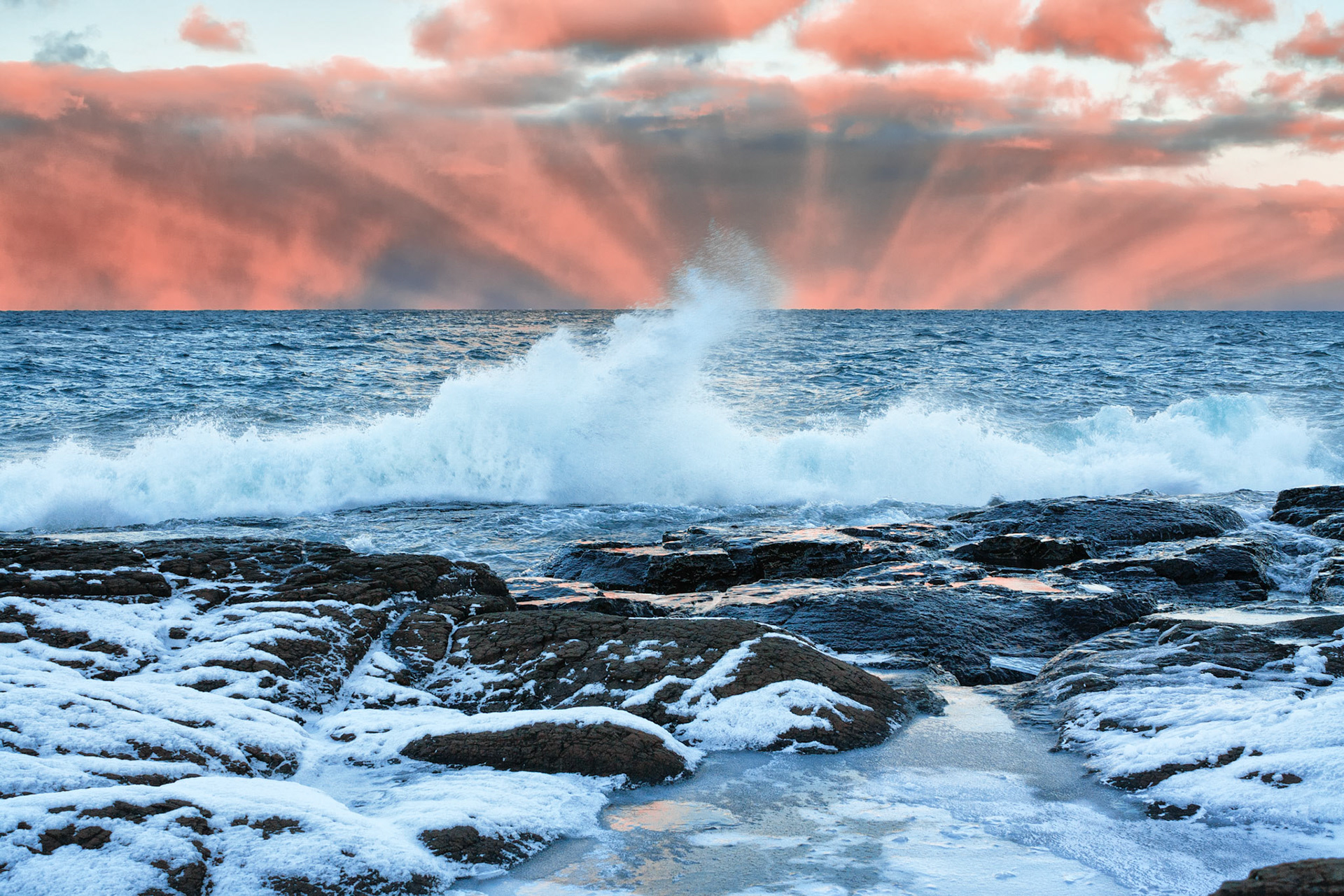 Breaking wave curling in the wind at Sunset Point, Presque Isle Park, Marquette, Michigan
