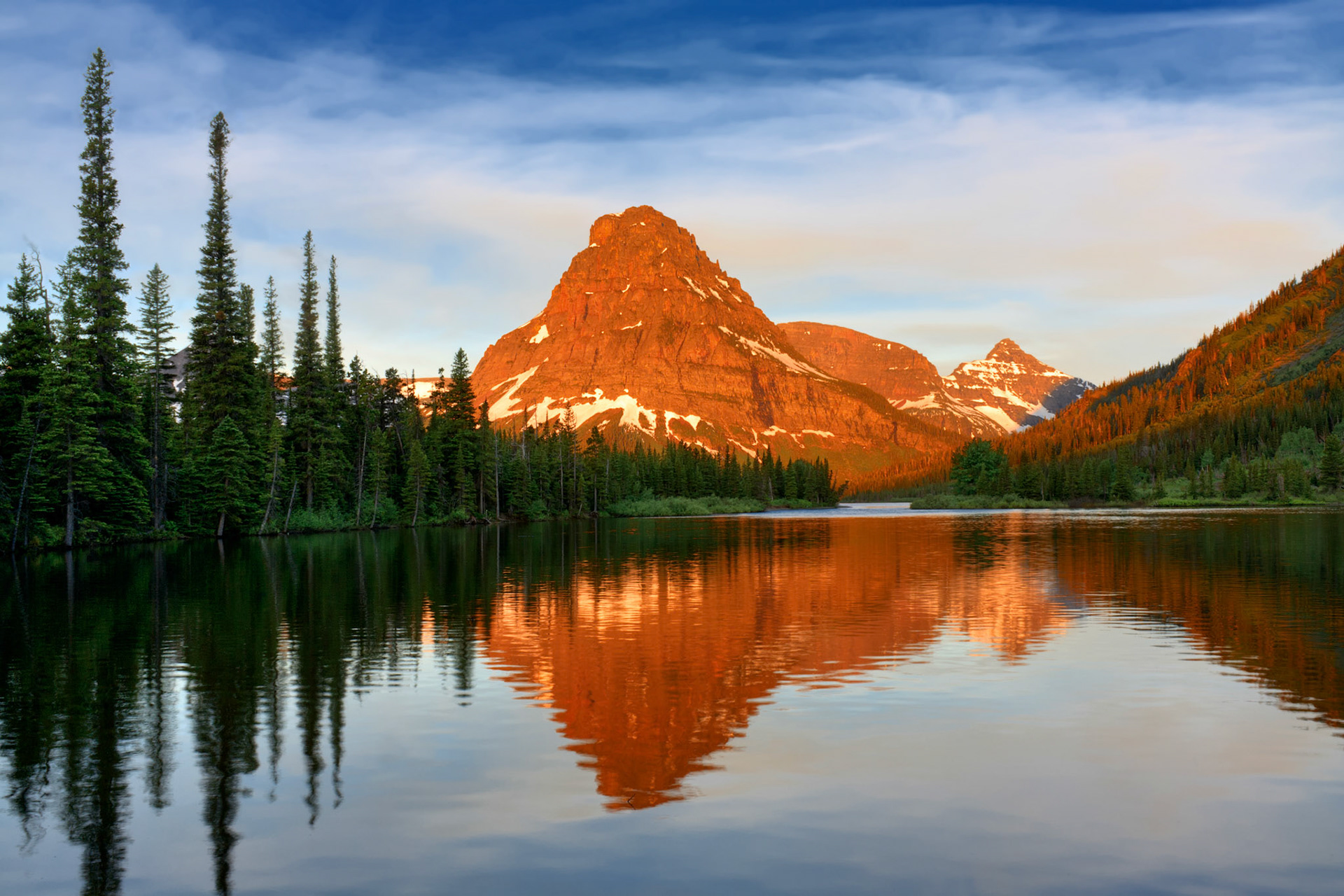 Sinopah Mountain reflected in Pray Lake at sunrise, Glacier National Park, Montana