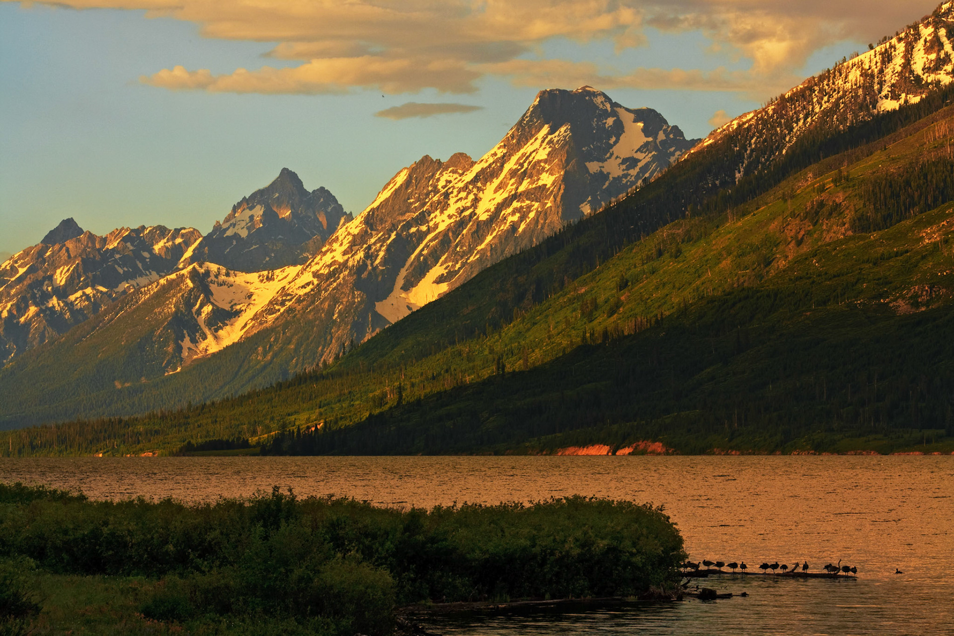 Grand Tetons at sunrise over Jackson Lake, Wyoming