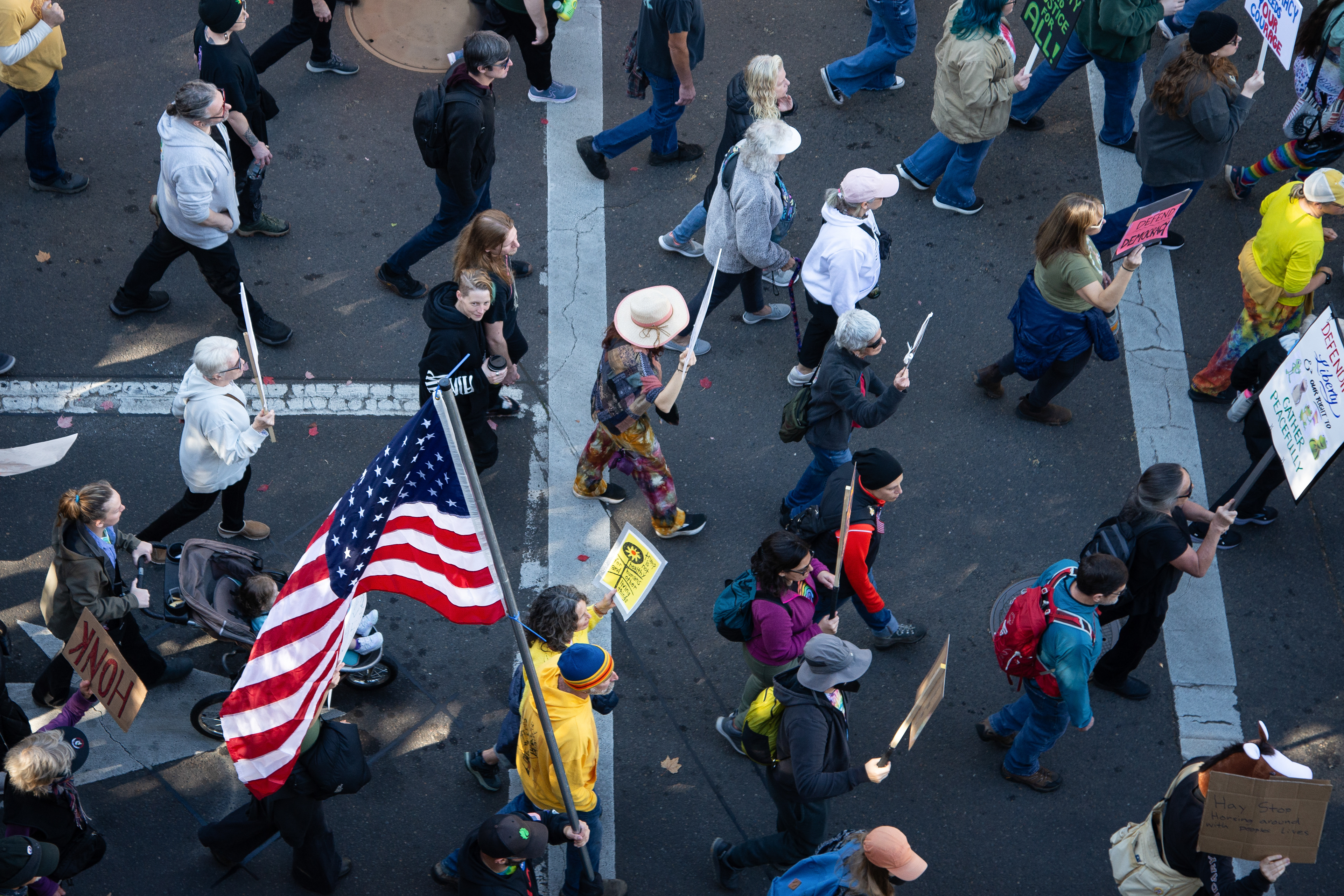 Protesters march in downtown Eugene for the No Kings Protest on October 18, 2025