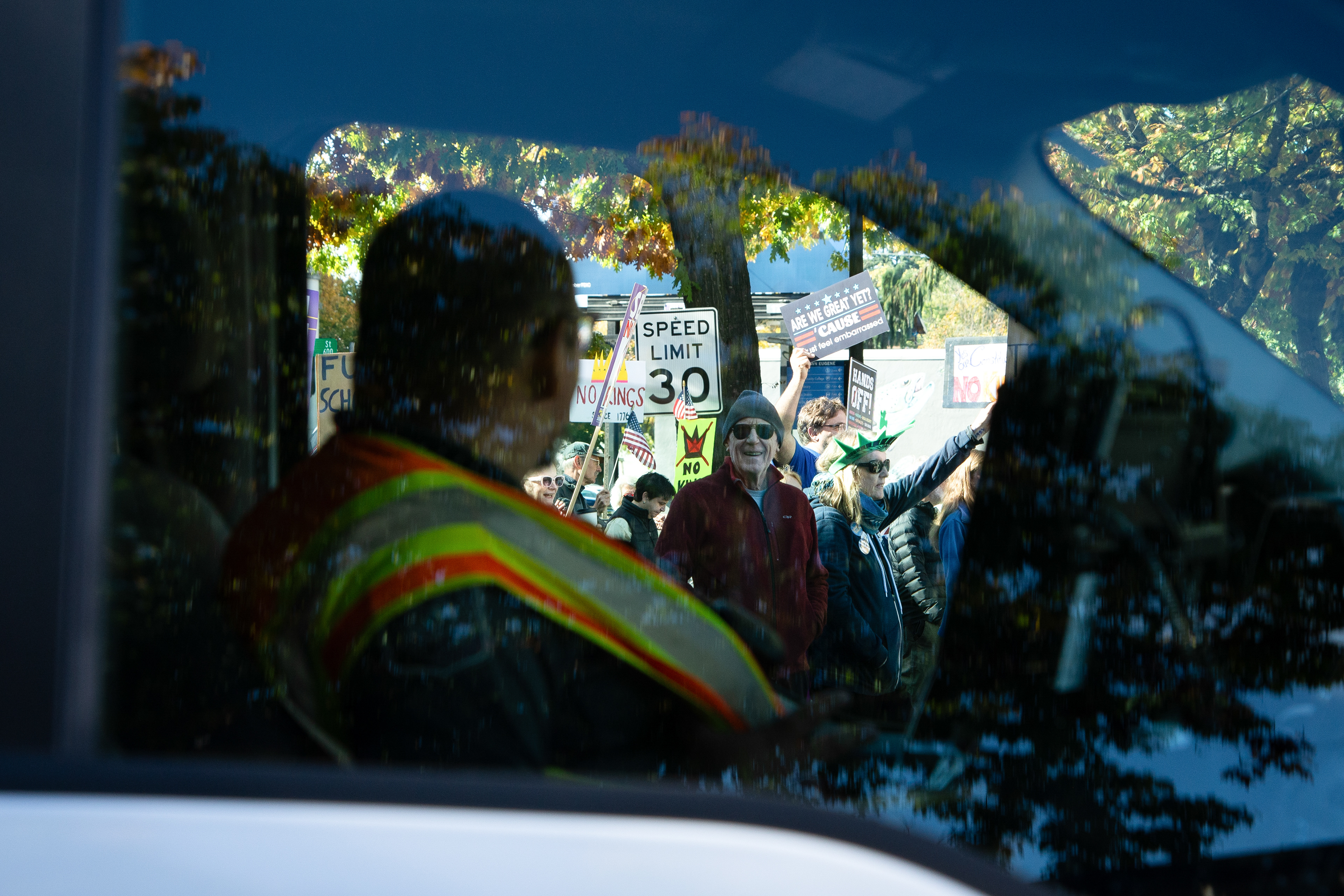 Two gazes meet during the No Kings Protest on October 18, 2025