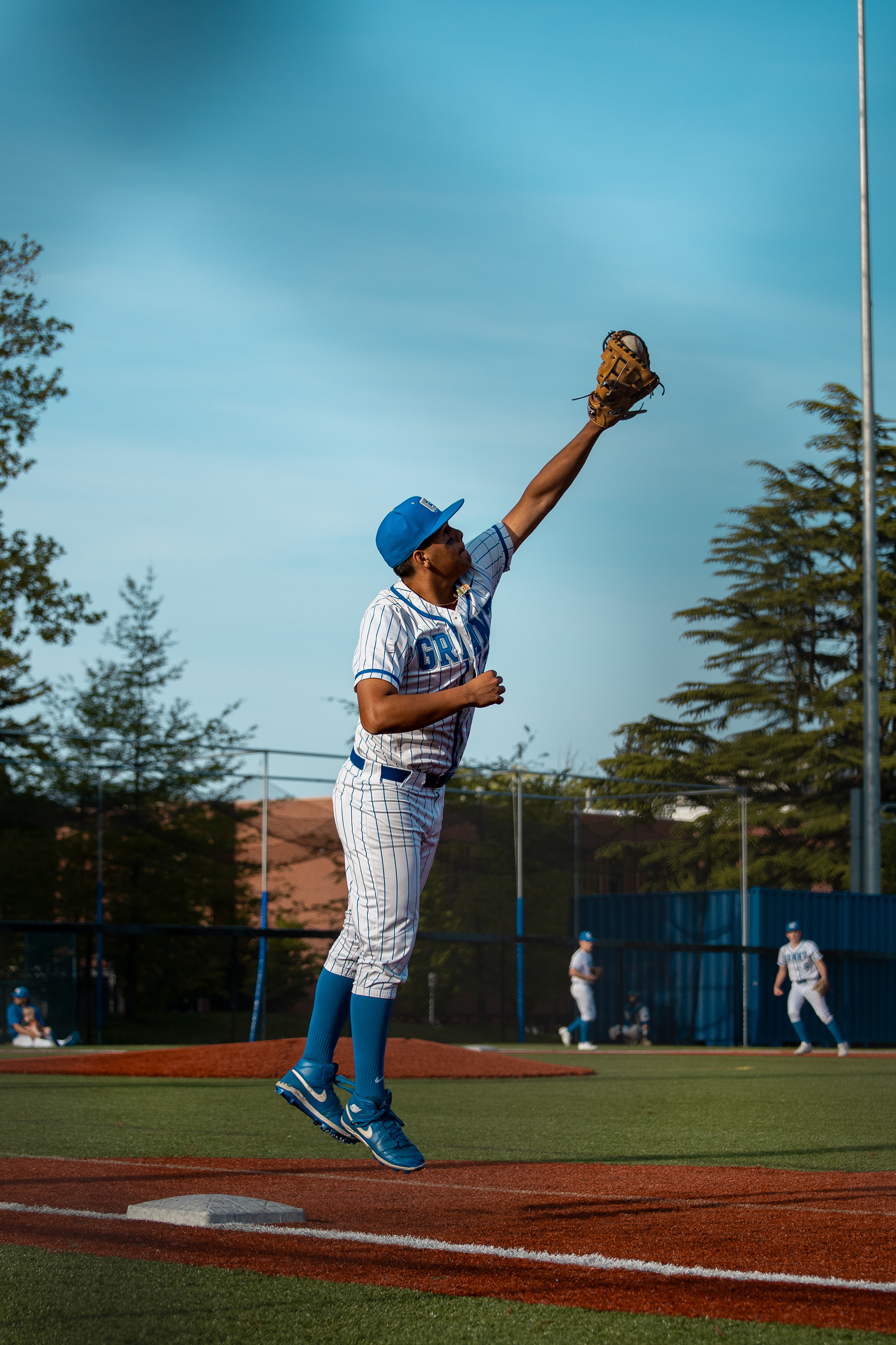 The first basemen on Grant baseball catches a high ball