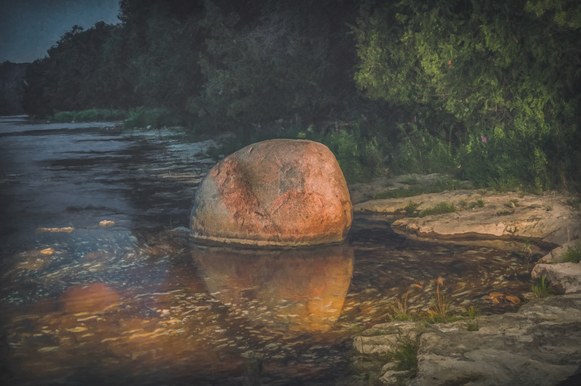 I remember this rock from my childhood. It's in the Maitland river near Goderich in the small hamlet of Benmiller. As kids we would love going down to the river and having fun. A few years ago my wife, Diane and I went back there and I went down to photograph it one evening.