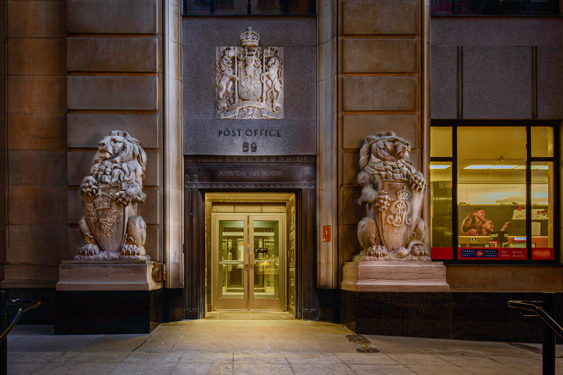 Stone lions stand guard outside the post office on Sparks Street downtown Ottawa