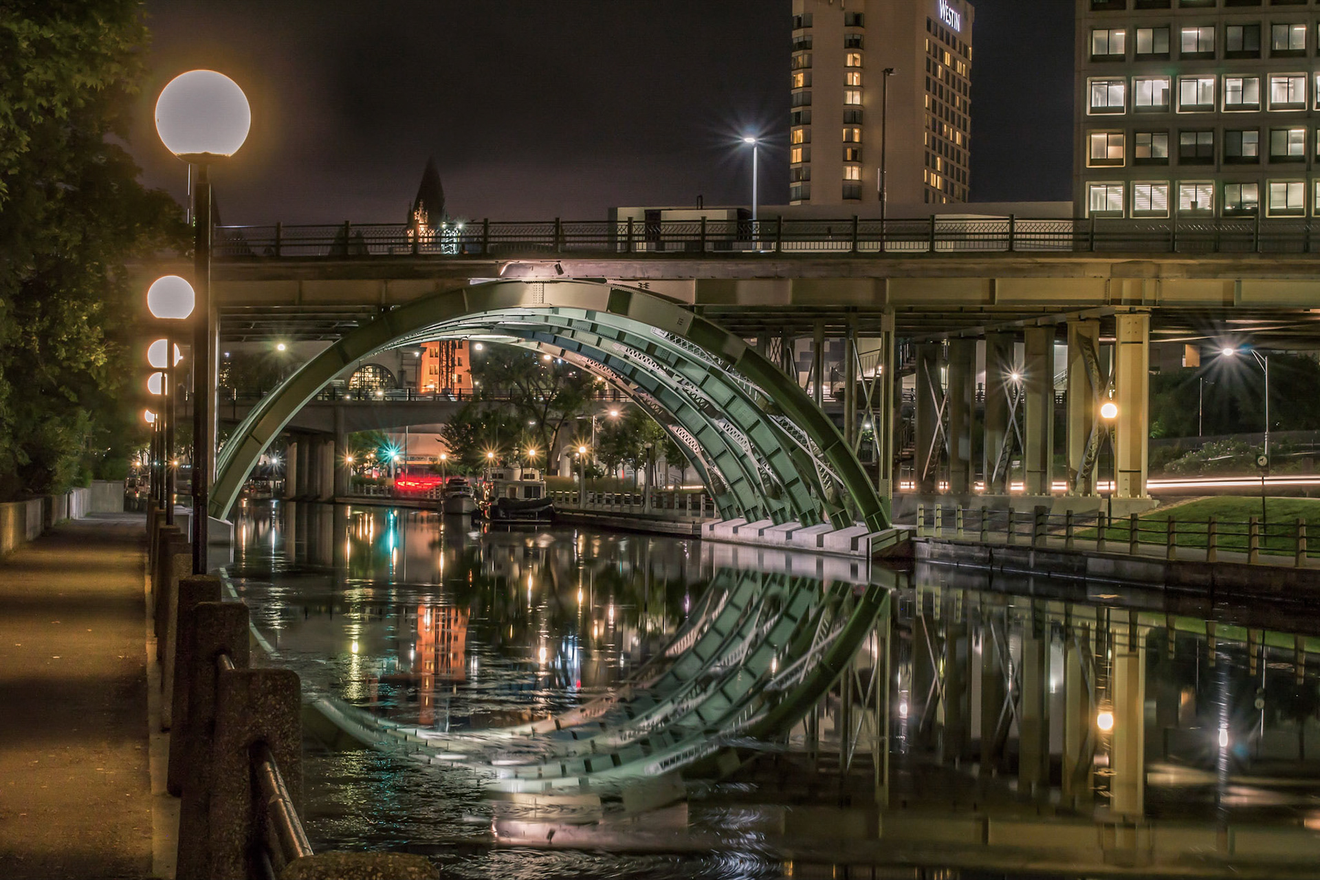 Interesting geometric reflection of the Laurier Bridge from the pathway on the west side of the canal.