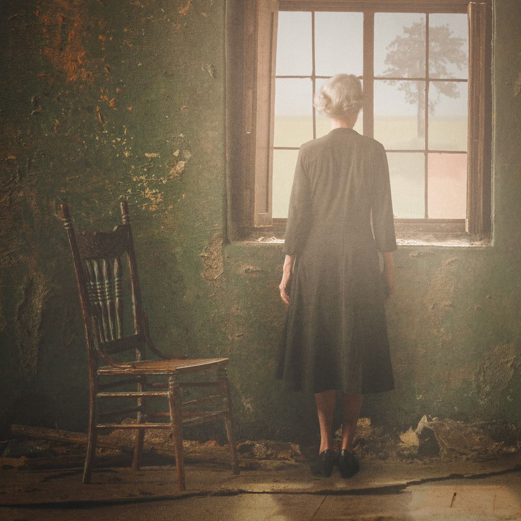 Woman at window by mark hogan photography