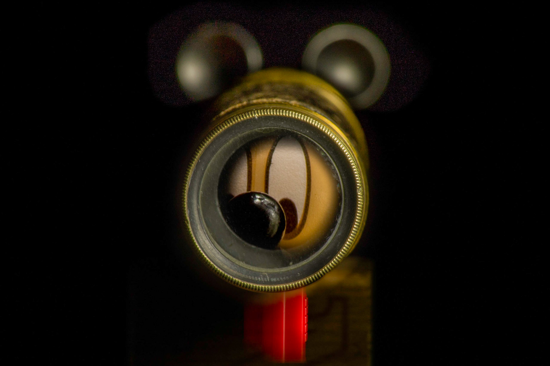 Mickey Mouse Pez dispenser looking through a telescope