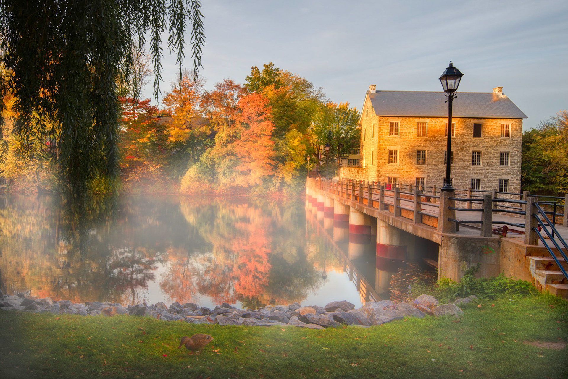 Mist rising from the reservoir one October morning at Watson's Mill, Manotick