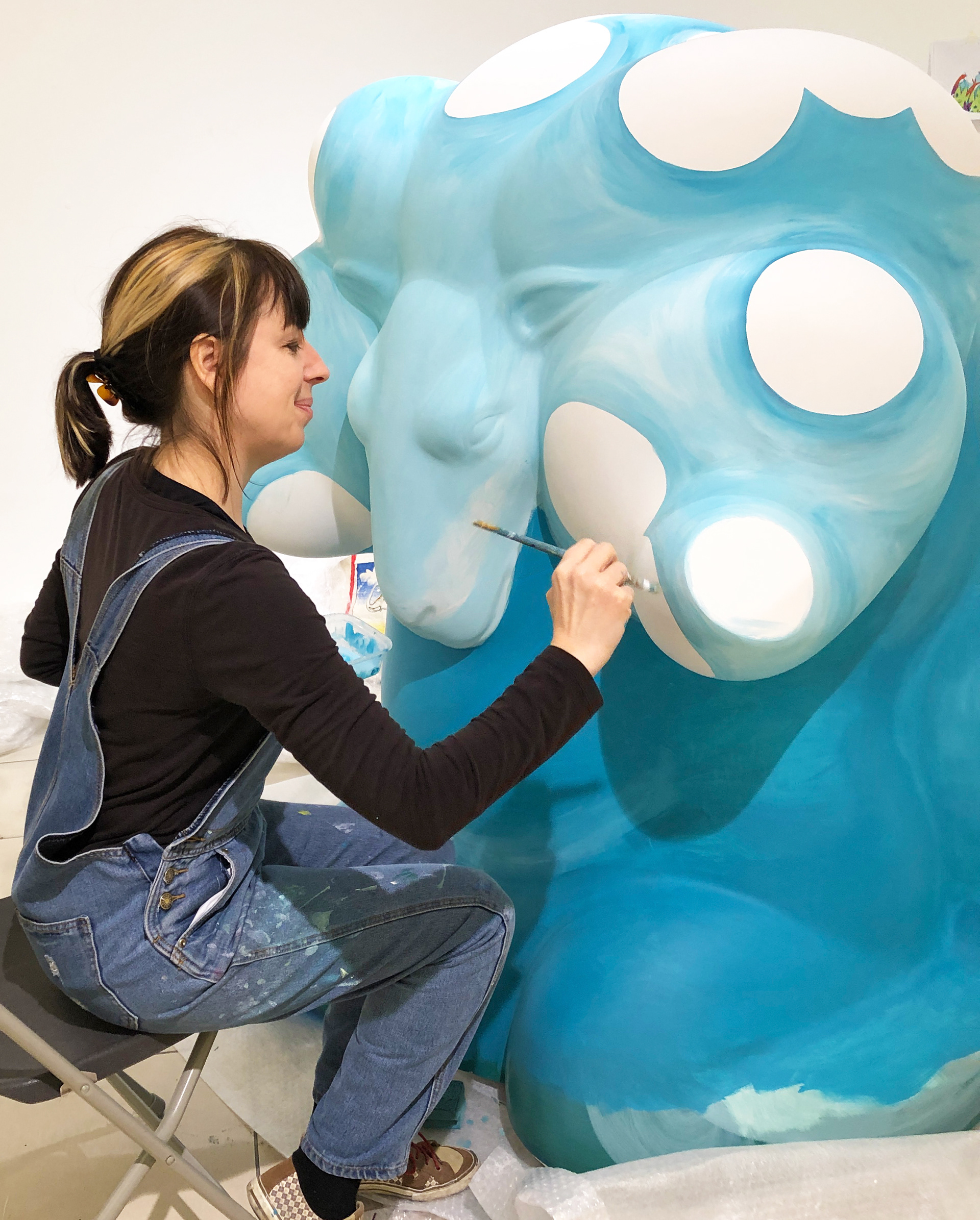 Lynne painting the Ram sculpture