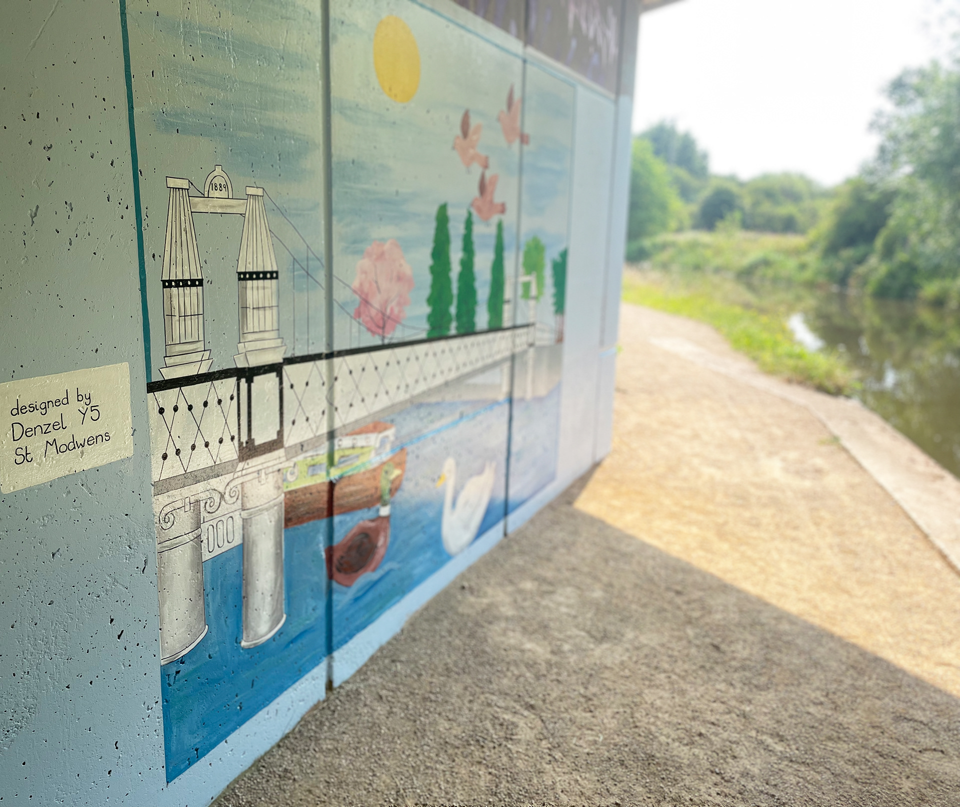 School children's designs painted on canal pillars