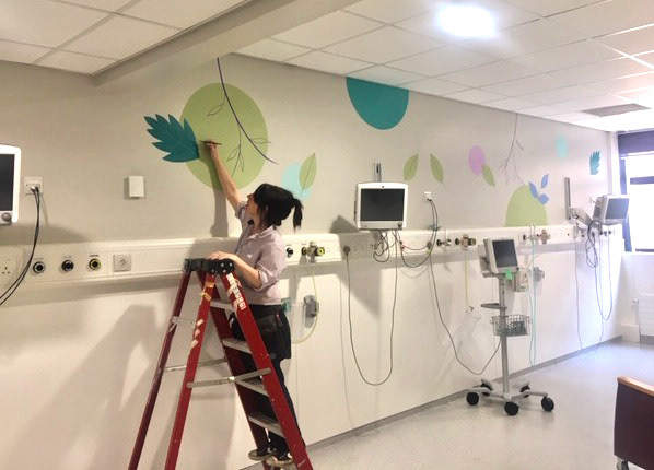Lynne Hollingsworth Painting Mural in SCBU Sheffield