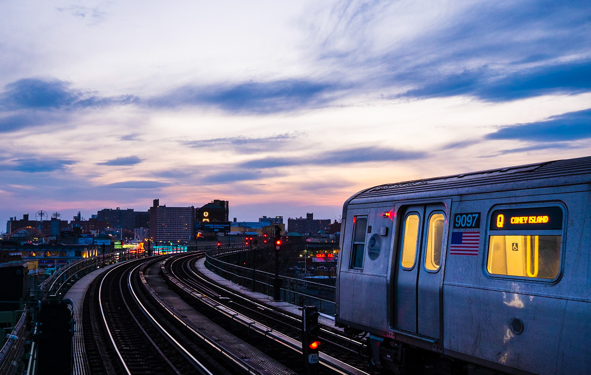 Subway car on elevated railway track in the evening at the blue hour, Coney Island, Brooklyn, New York City, USA