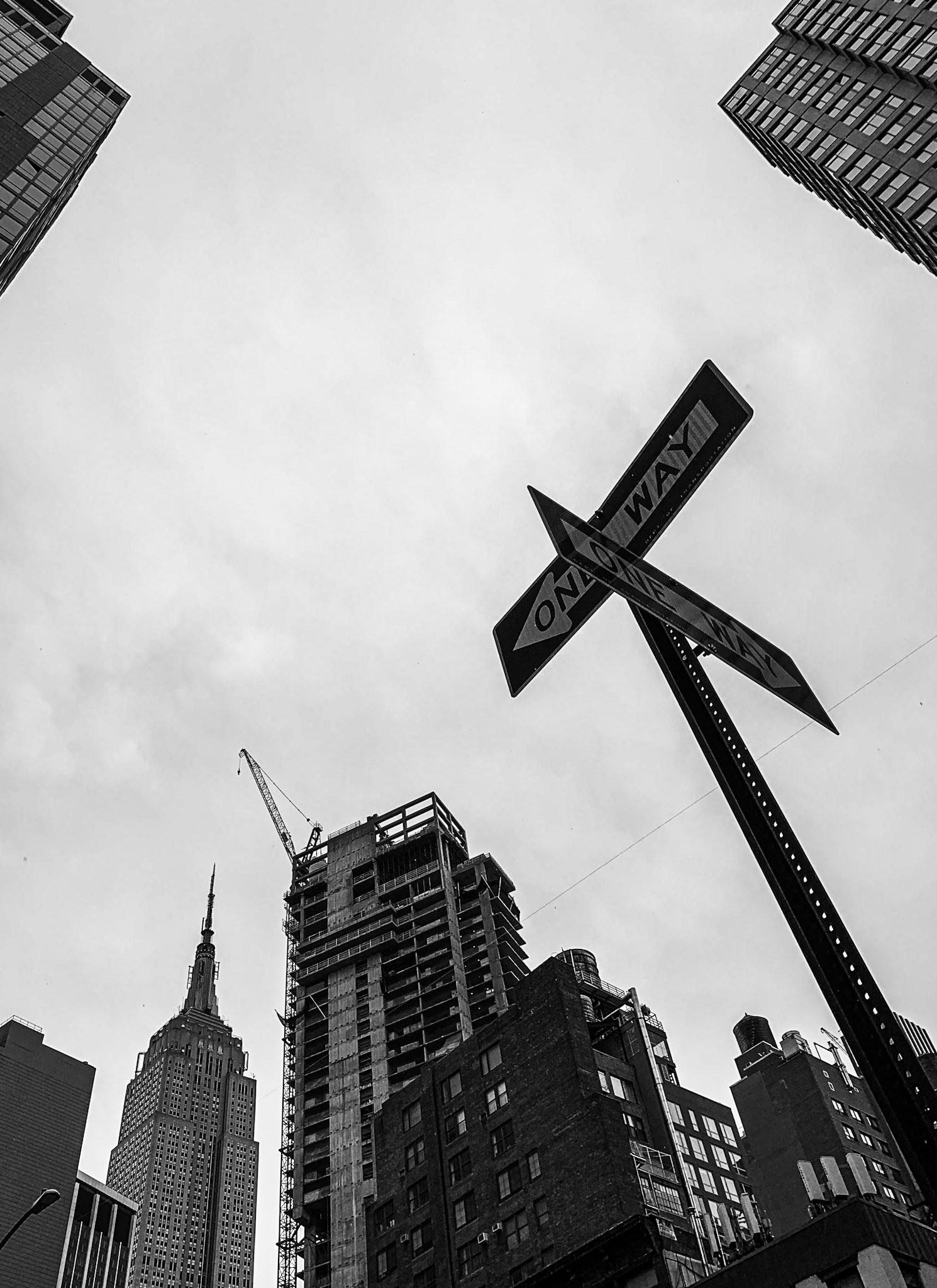 Silhouettes of the Empire State Building and other skyscrapers and traffic signs, Koreatown, Manhattan, New York City, USA