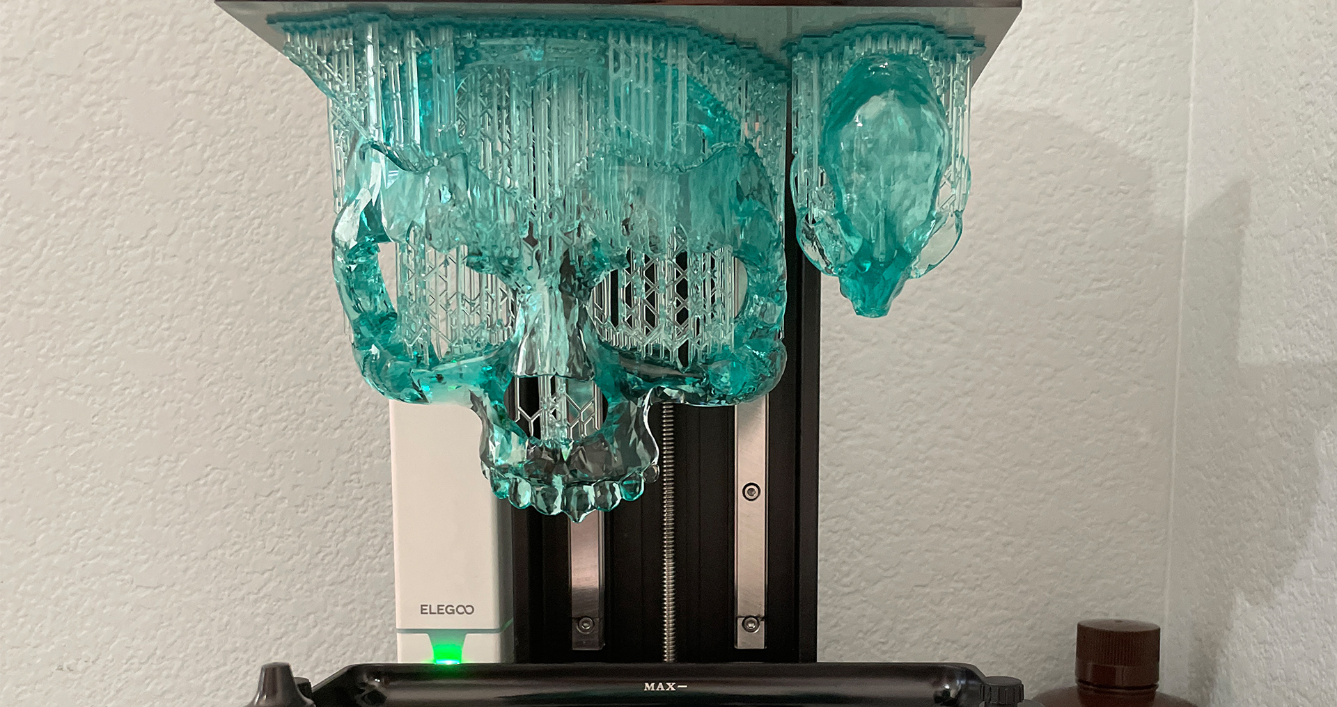 Thingiverse sourced skulls, printed with ink stained clear resin.