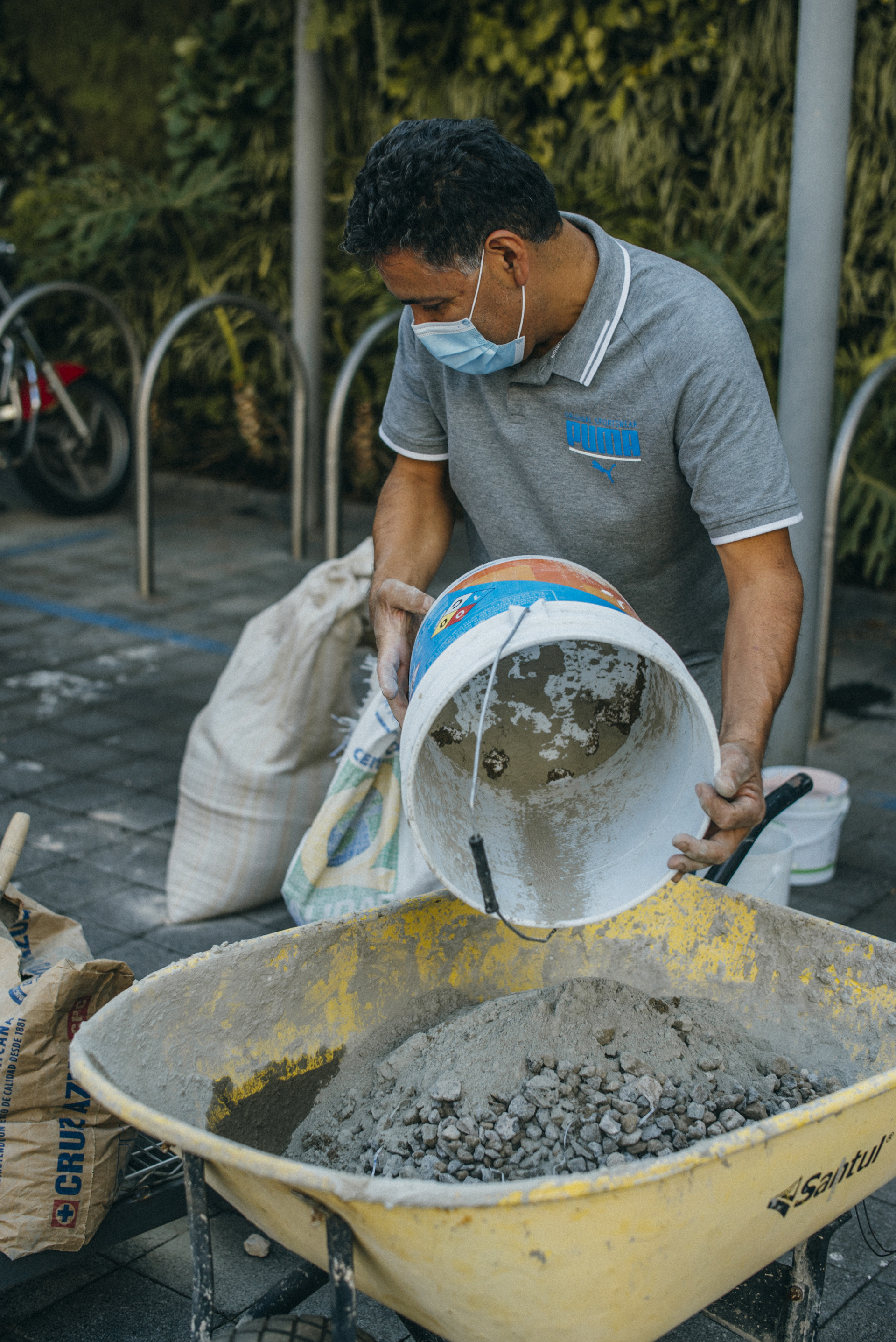 4 - Participants contribute by providing materials and tools on-site to mix and pour concrete in the completed Dispersed Memorial mold.