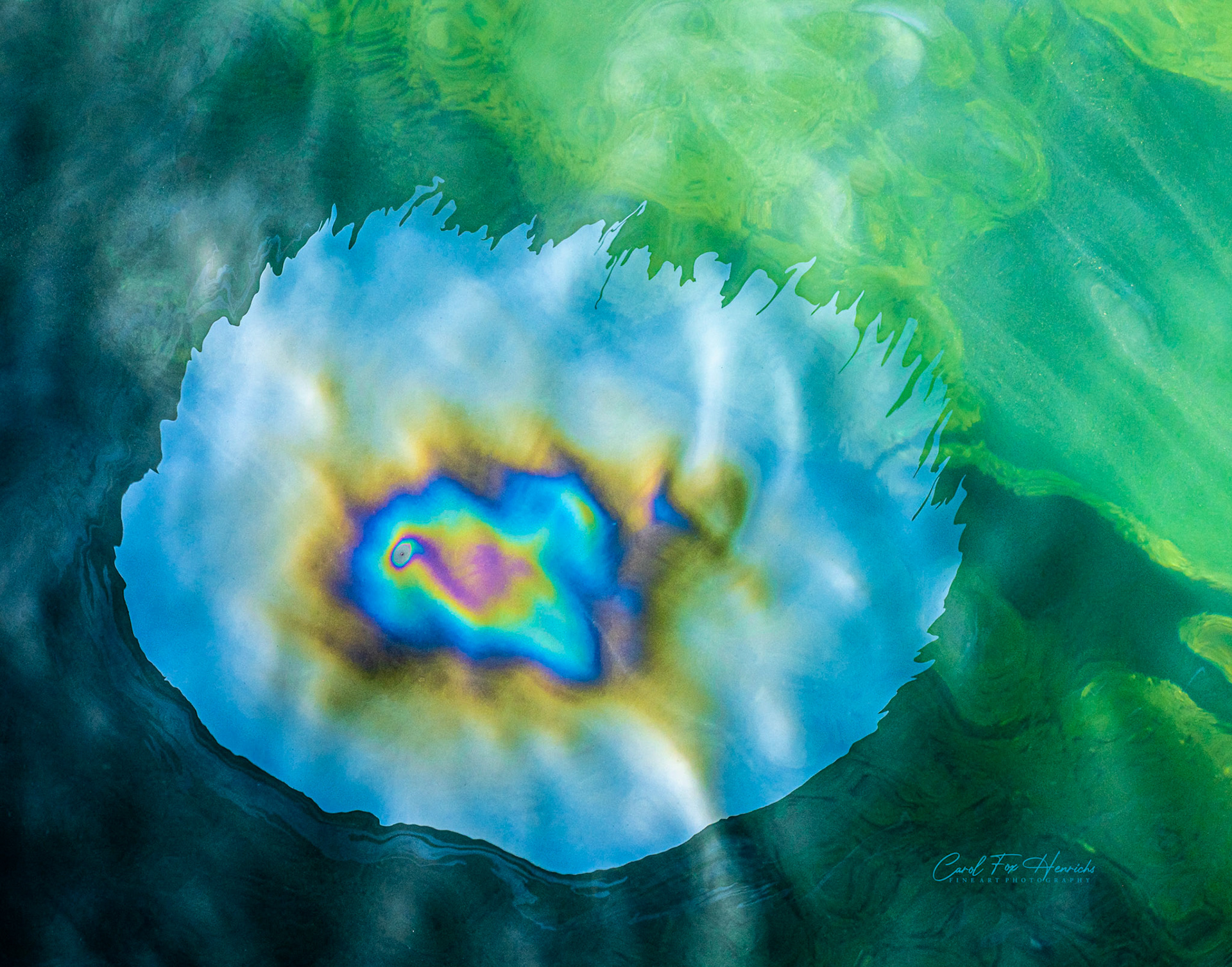 Fuel continues to leak from USS Arizona's wreckage. I saw this when I visited in February 2020. This iridescent sheen, no more than12 inches long, appeared just long enough for me to squeeze off a few shots. In less than 5 seconds it was gone. The nebulous blob, sometimes called tears of the Arizona or black tears, seems to float just above the water's surface. It is an eerie reminder of the things that are still trapped in the ship below.