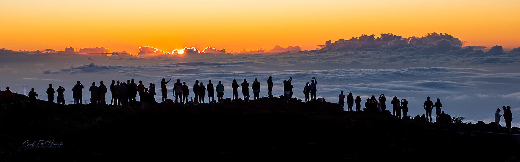 Watching the sunset at the Haleakalā volcano crater feels like you are standing on top of the world. Surrounded,  the crater appears to float on a sea of clouds.