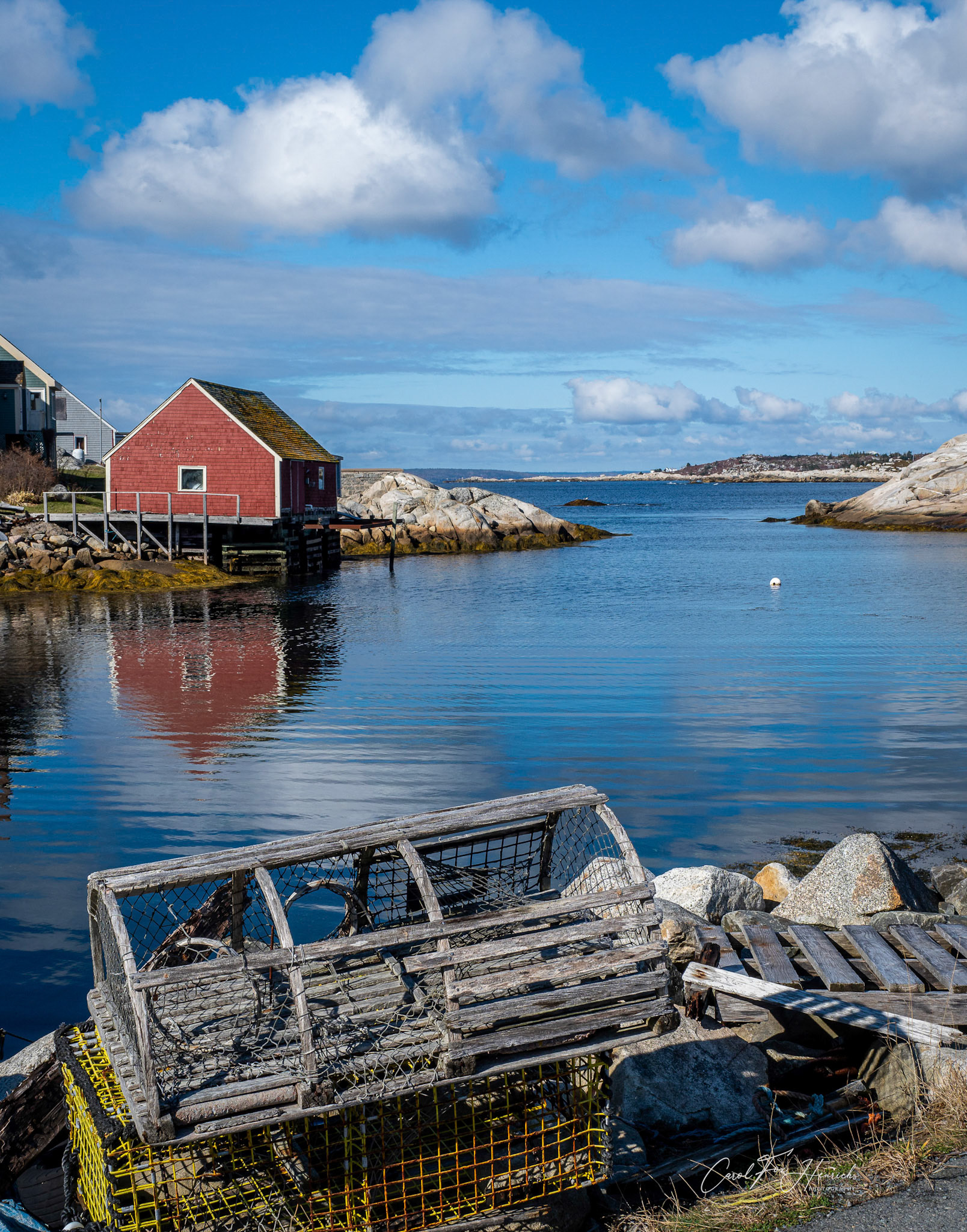 Lobster traps are stacked on the dock at the end of the season.