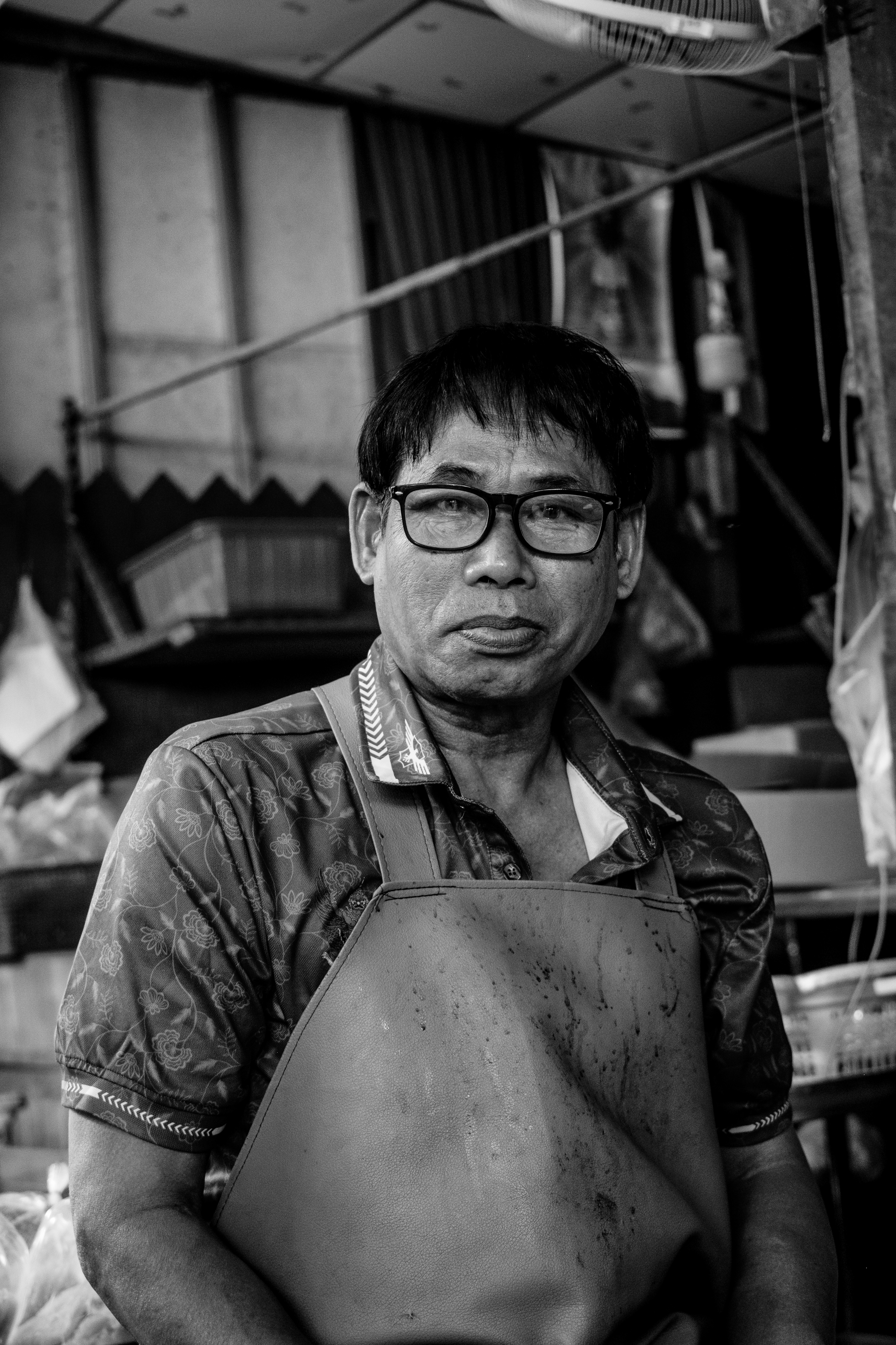 Portrait of a butcher in the Maeklong train marke. Bangkok, Thailand