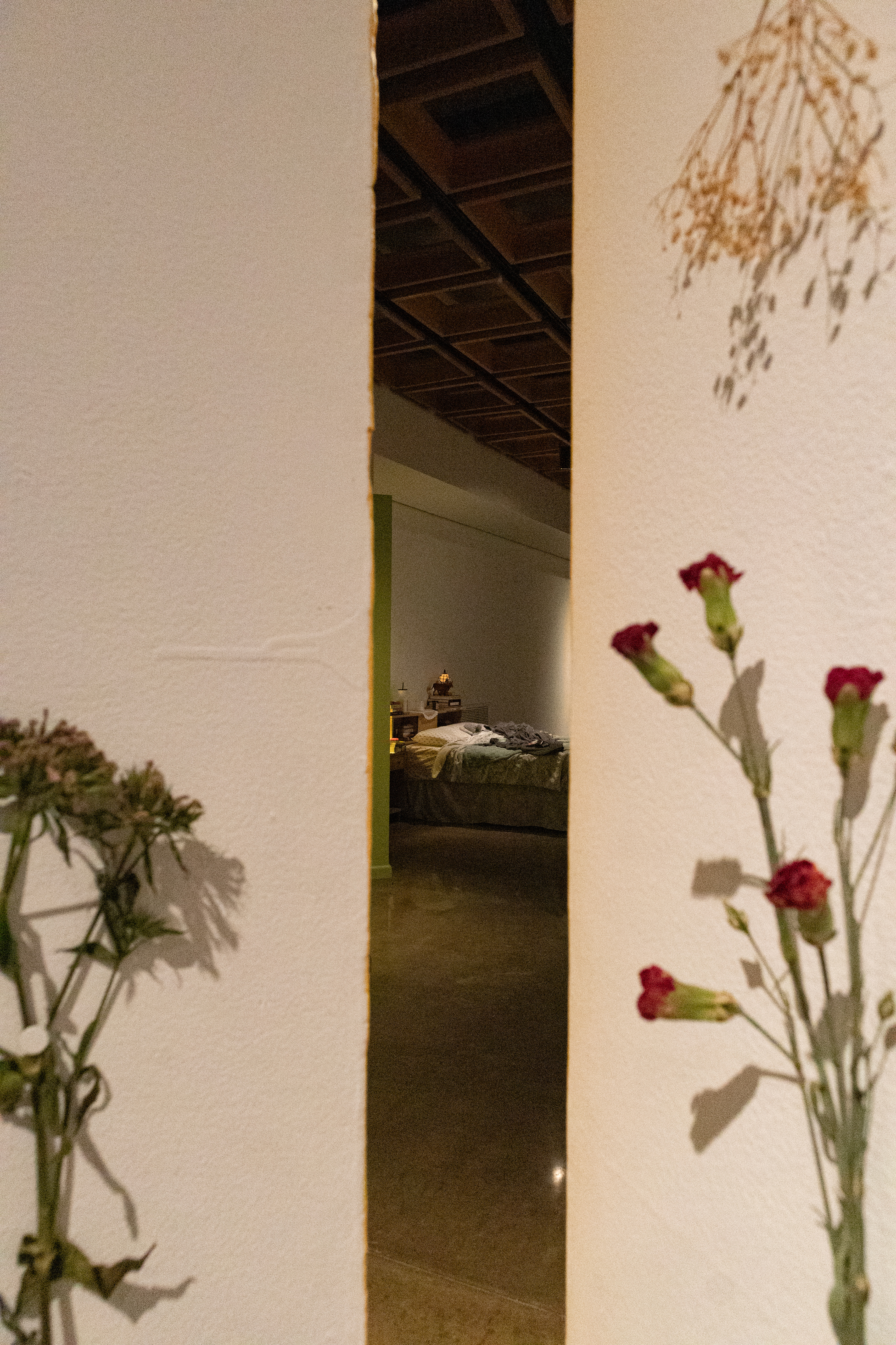 view of our bed through ongoing, flowers for moms