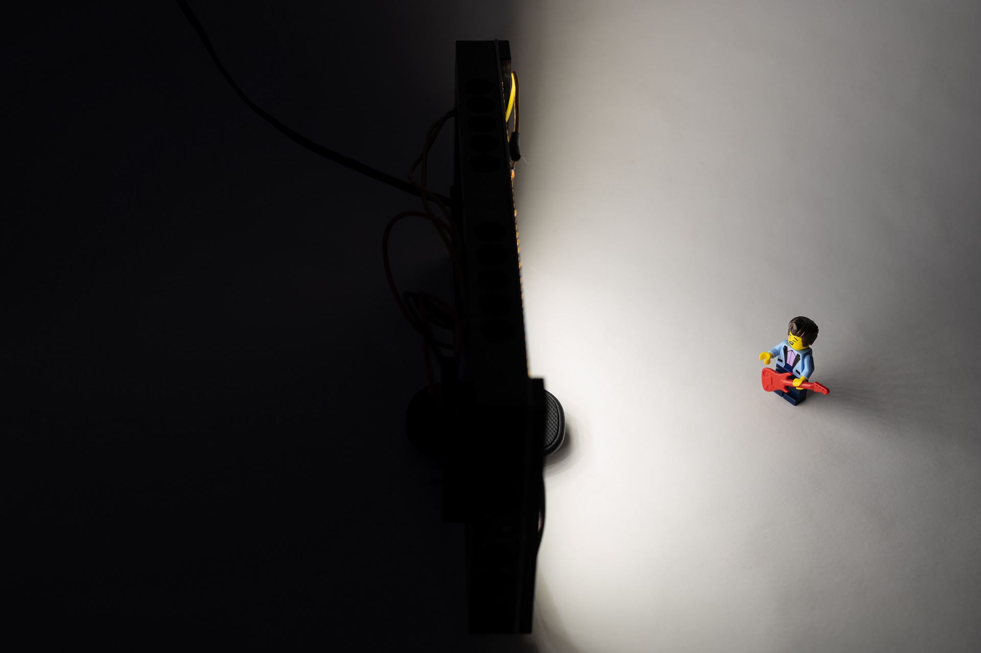 Illuminating a subject - Not sure if he is squinting from singing or the bright light.