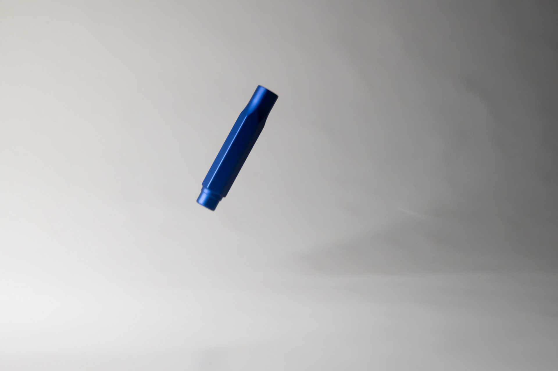 Blackwing pencil cap in midair