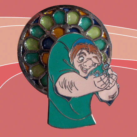 Disney's Quasimodo character pin. The character is nesting a blue bird in his hands, both looking at each other. This is a two-layer pin, where the character layer is sitting on top of the bottom layer which is fashioned to look like a stained glass window, where the stained glass sections are filled with individual colors of yellow, green, blue, and orange translucent fills, mimicking an actual stained glass window. The pin sits atop a burnt orange background of three different values, light, medium, and dark arranged to have a swoosh-like feel from left to right..