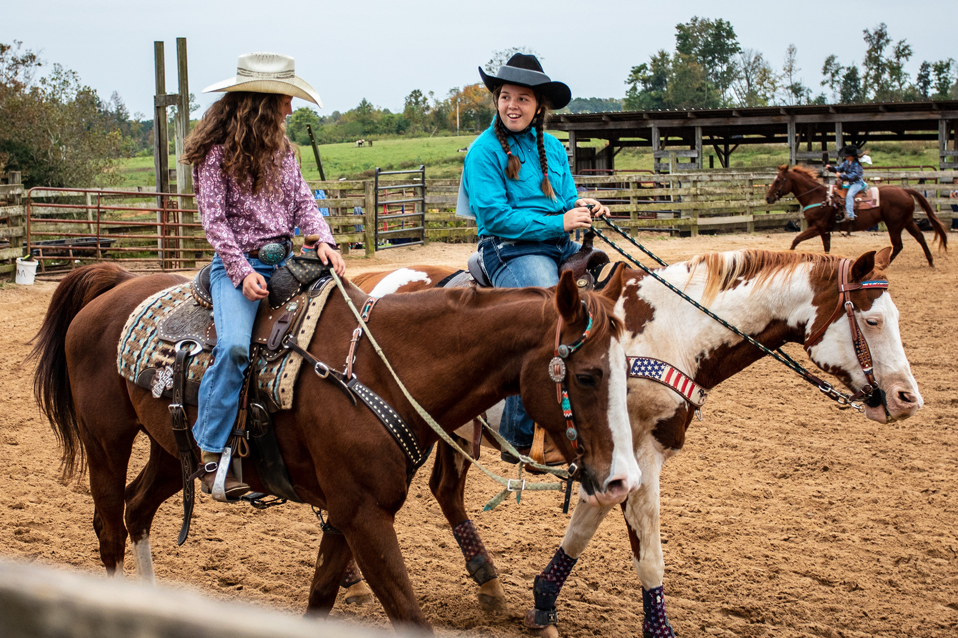 Makenzie Barrow (right) and Lila Williams ride horses during the North Carolina Rodeo Association Finals on October 9, 2020.