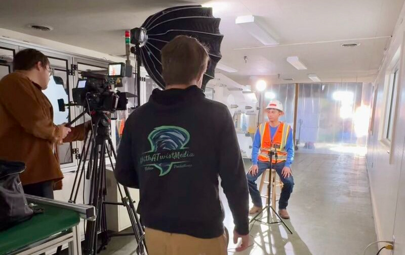 Interview with a construction worker in hard hat and hi vis for a Vitaflex product video