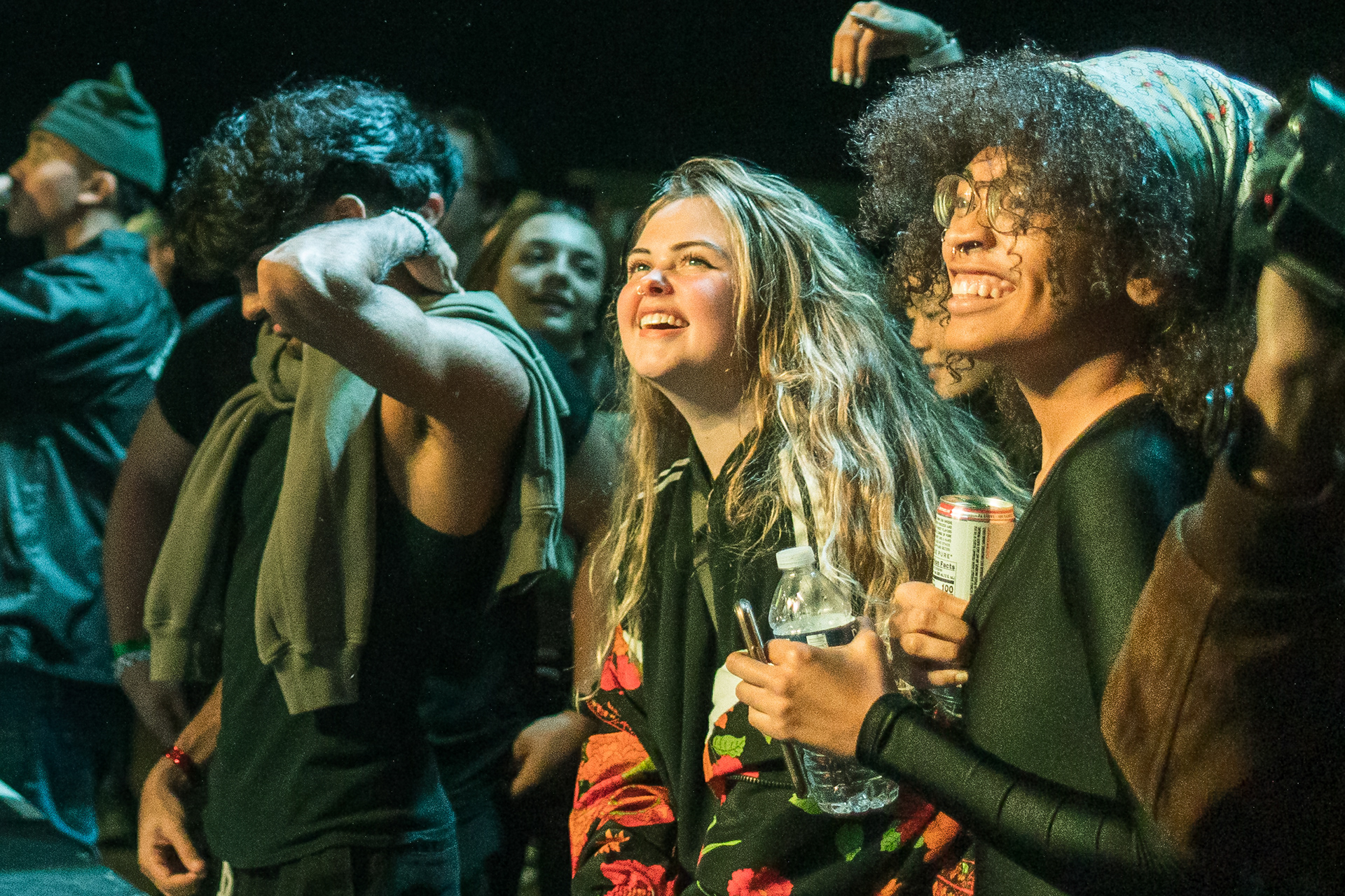 Savannah (middle) enjoys live music in the crowd at December in The Carolinas in Durham, N.C. on December 21, 2021.
