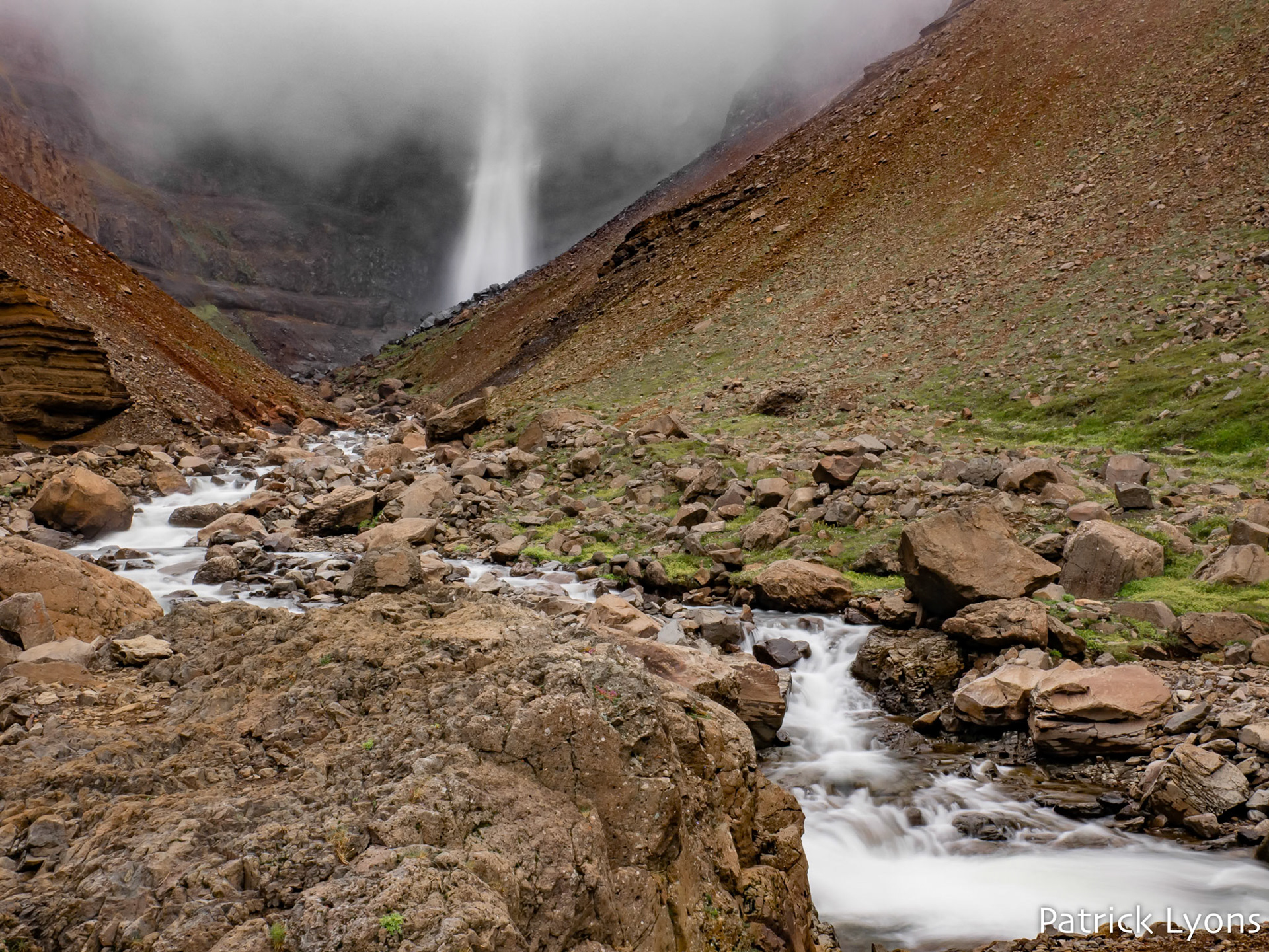 Hengifoss shrouded in fog in Iceland