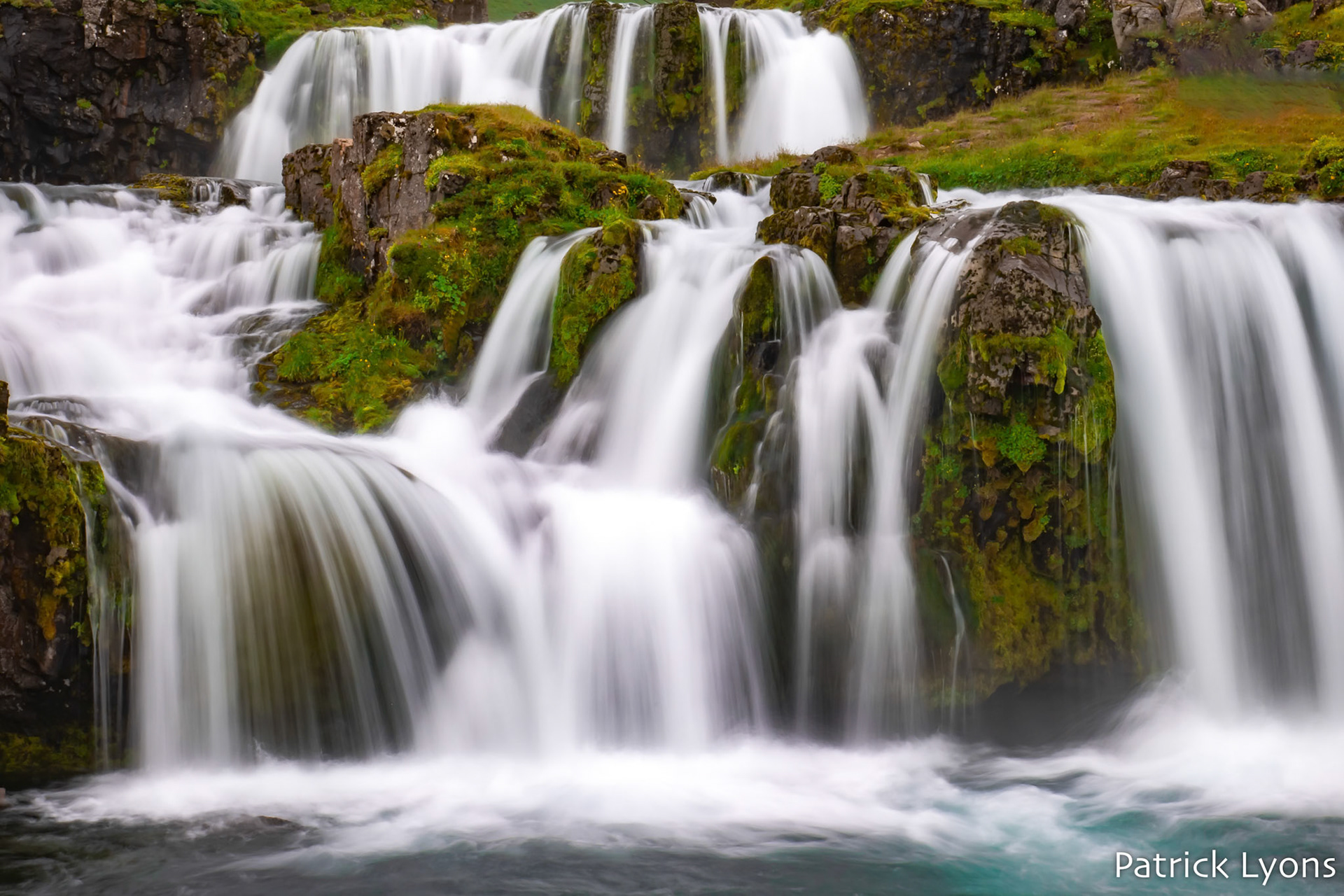 Kirkjufellsfoss waterfall and Kirkjufell Mountain