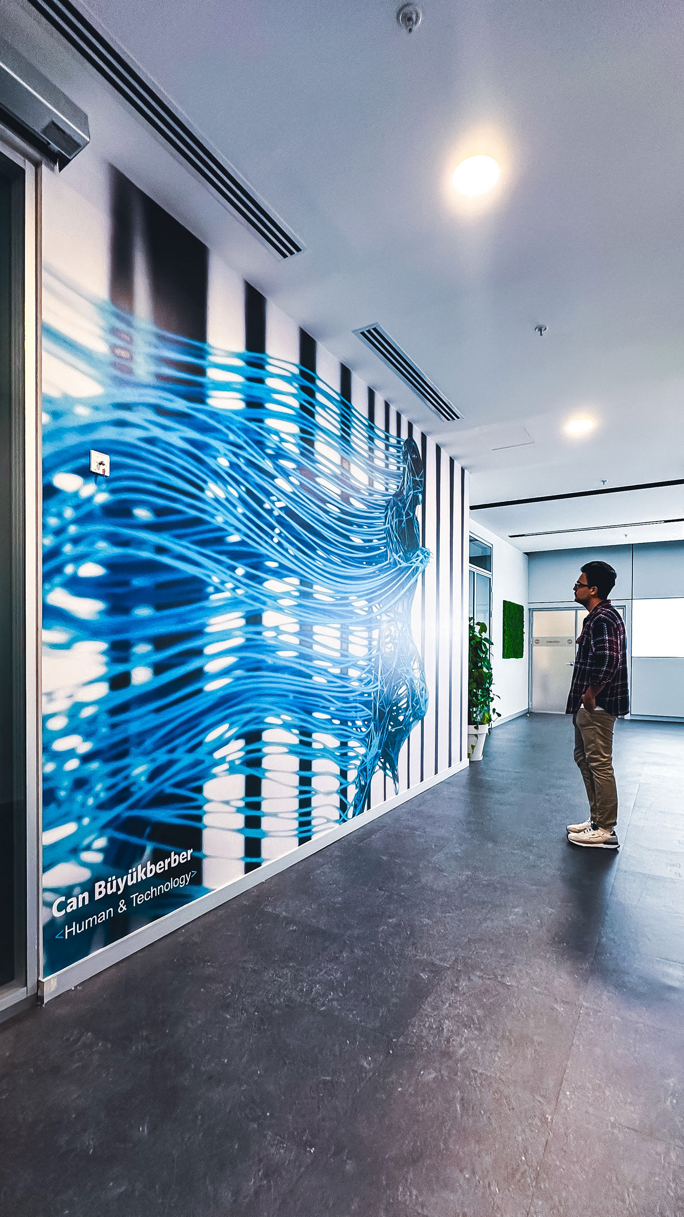 Large digital prints are on display at the Togg Campus
